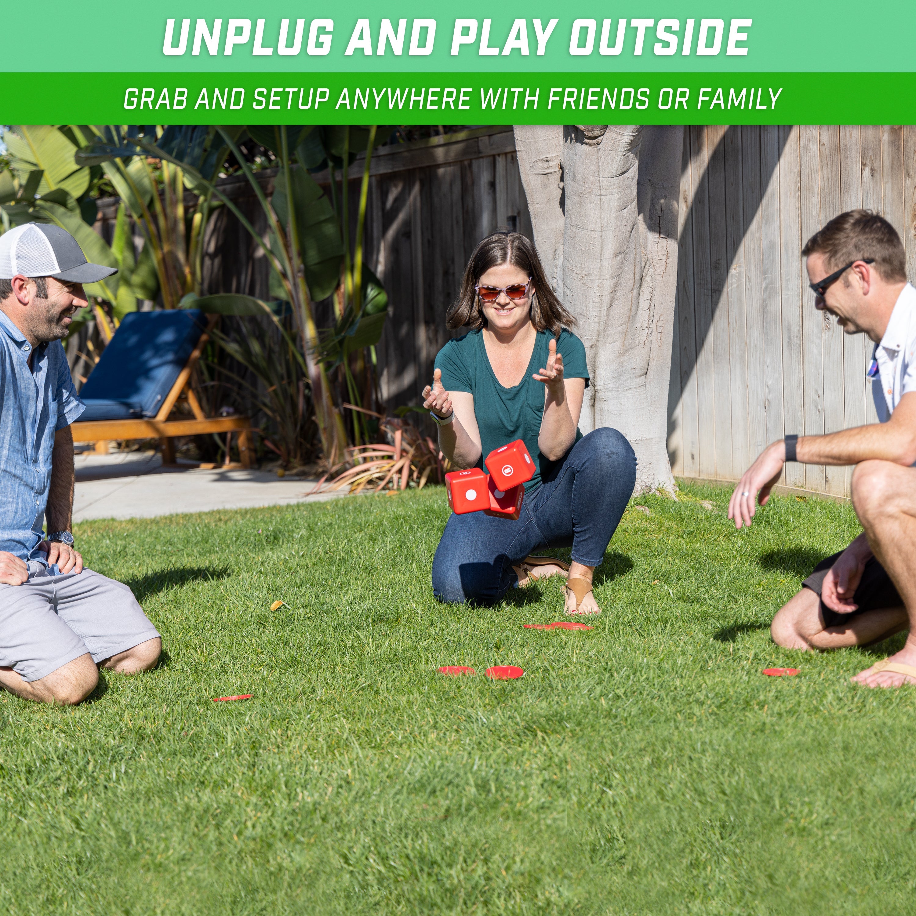 a group of people sitting on the grass