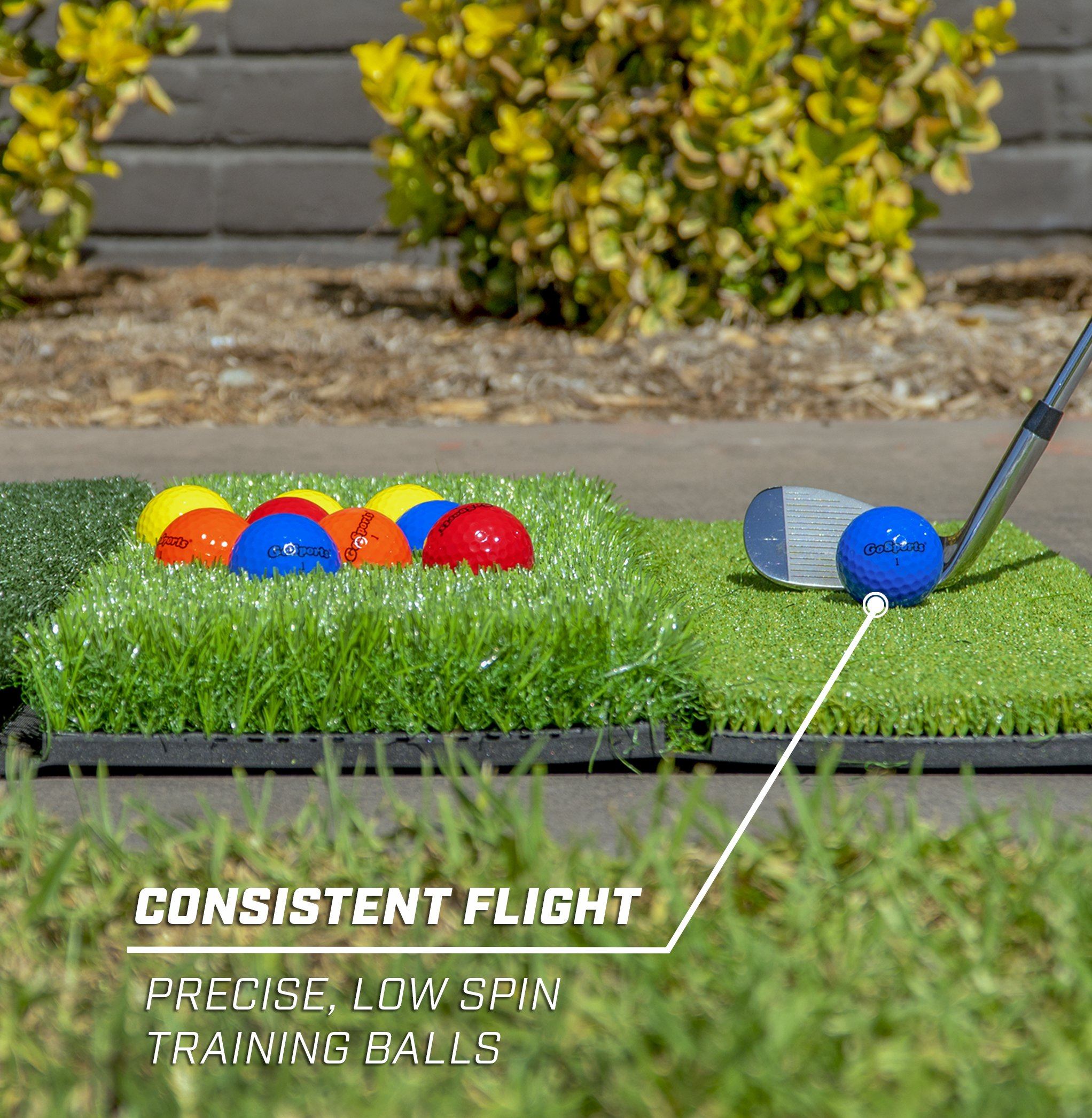 a golf ball and a golf club on the grass