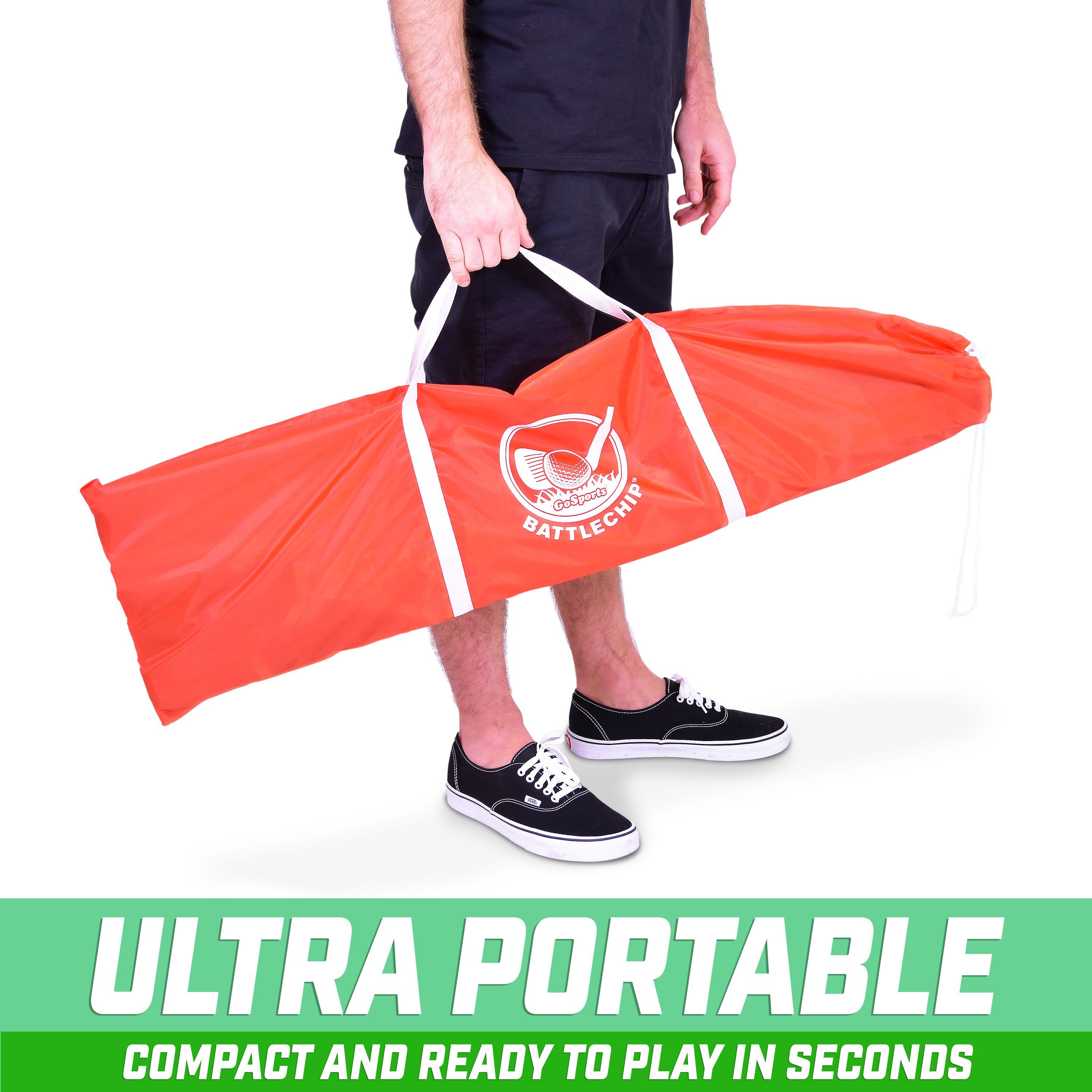 a man holding a red and white bag