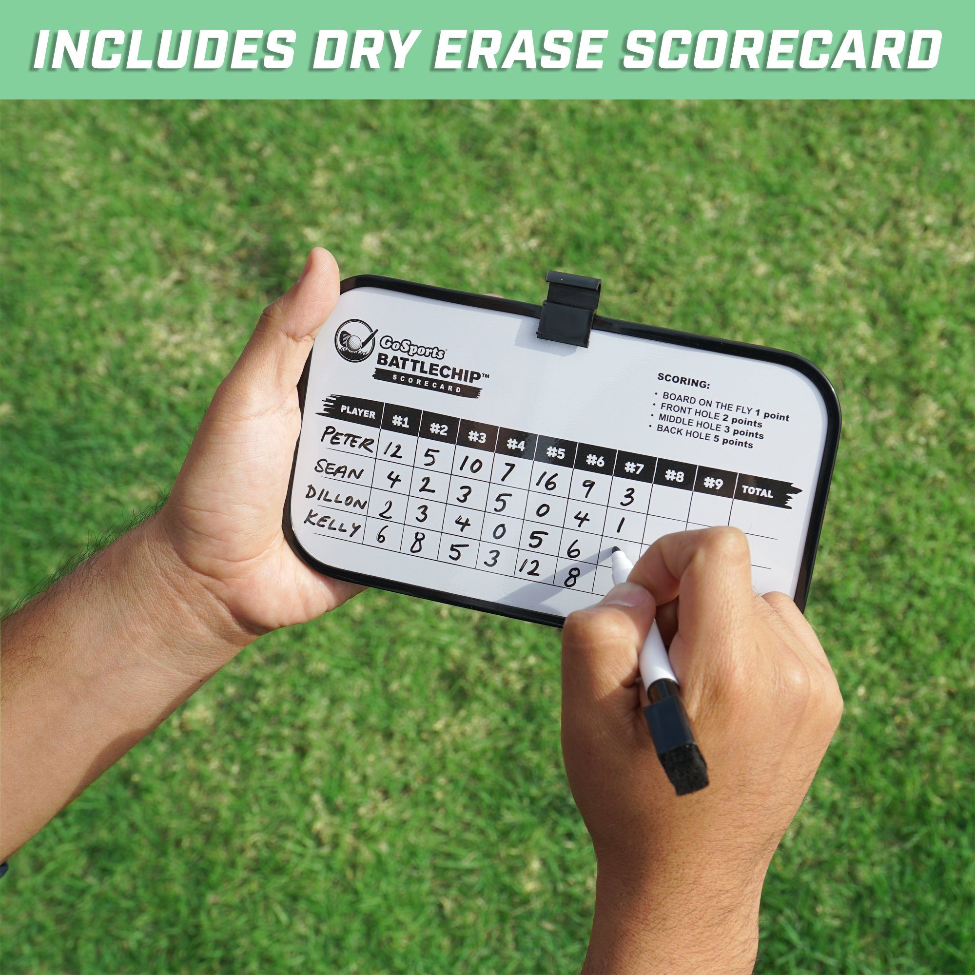 a person holding a cell phone with a score card