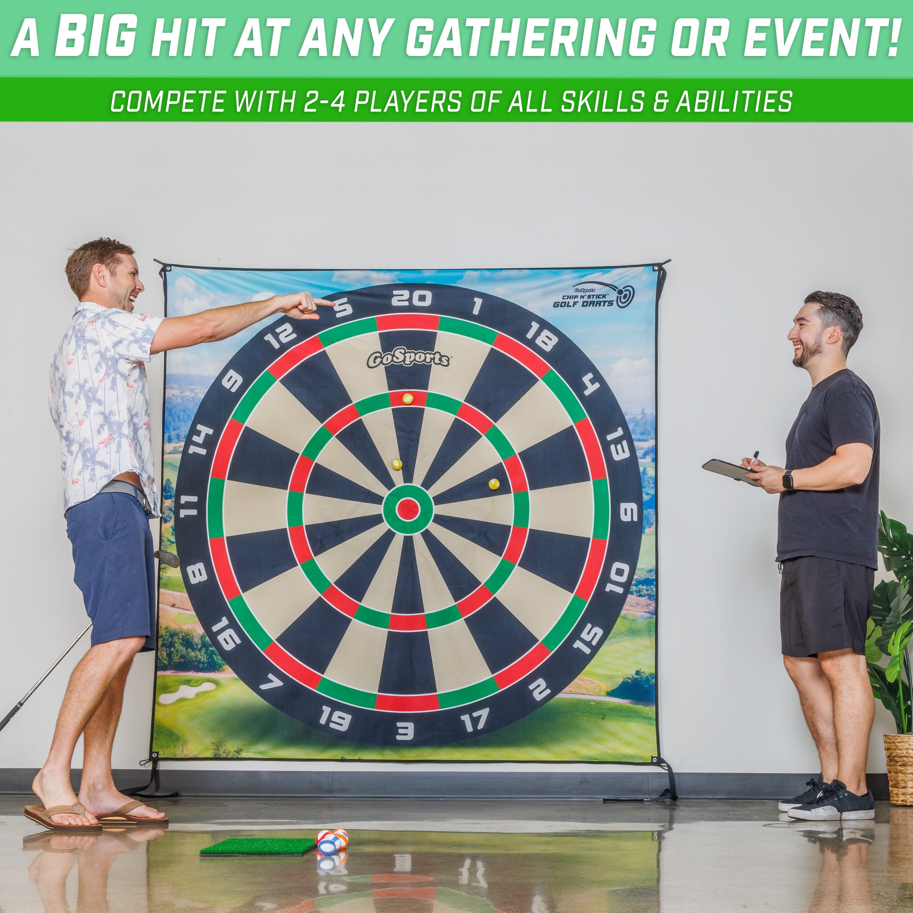 a man holding a dart and a dart