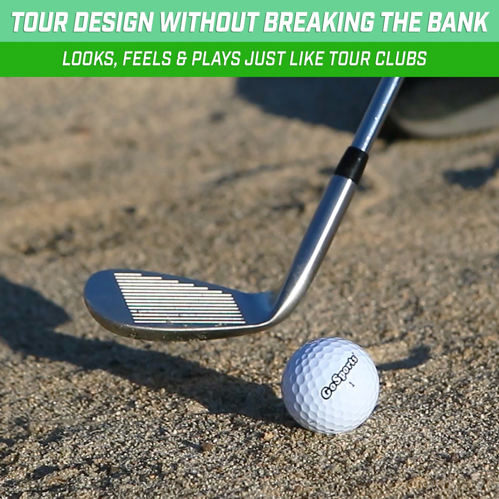 a golf ball and a golf club on the sand