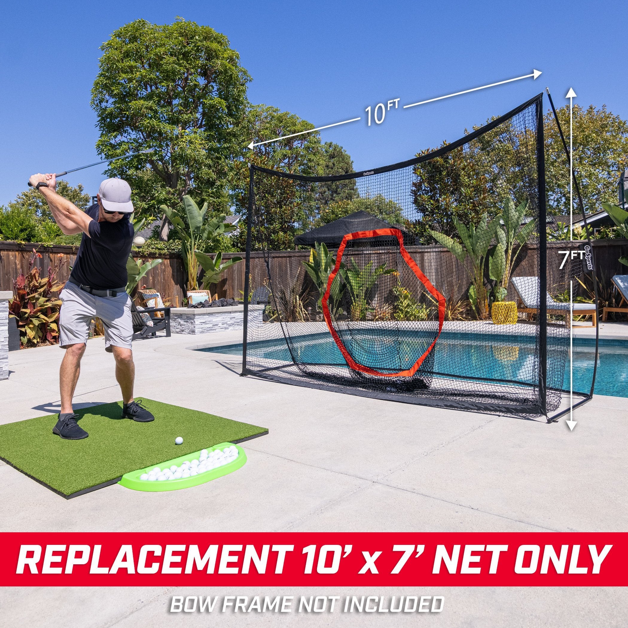 a man is playing golf in the backyard