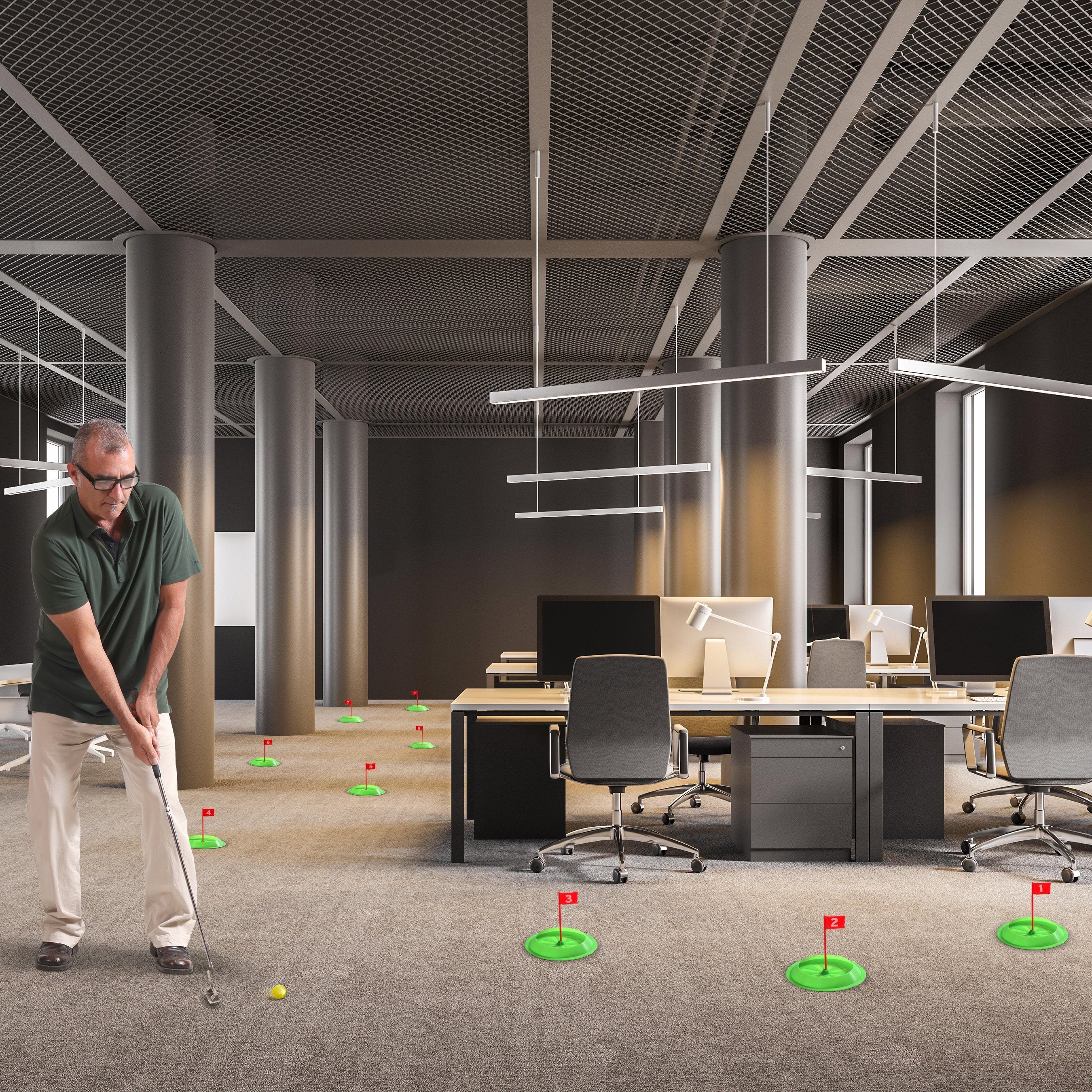 a man playing golf in an office