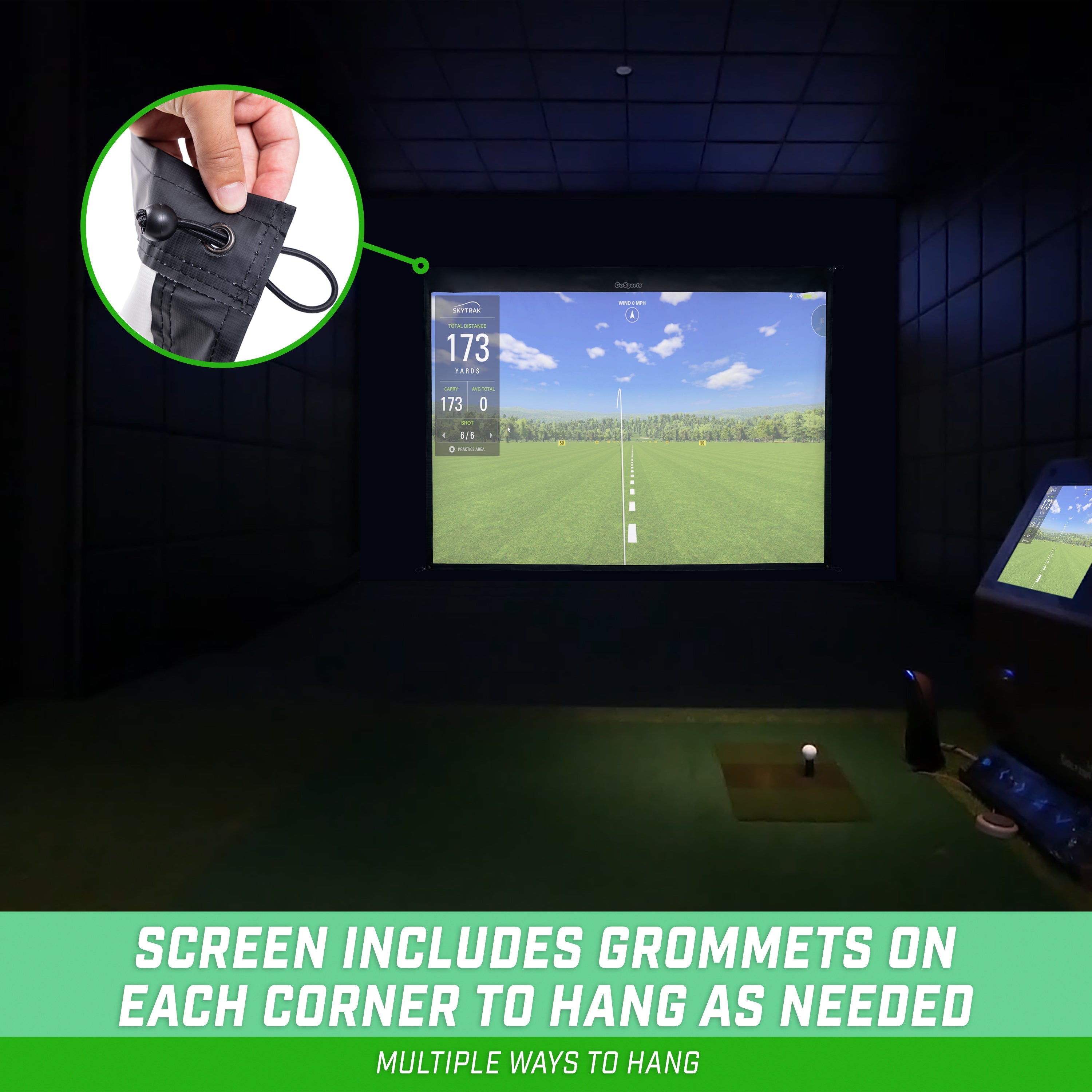 a golf simulator with a green screen and a golf ball