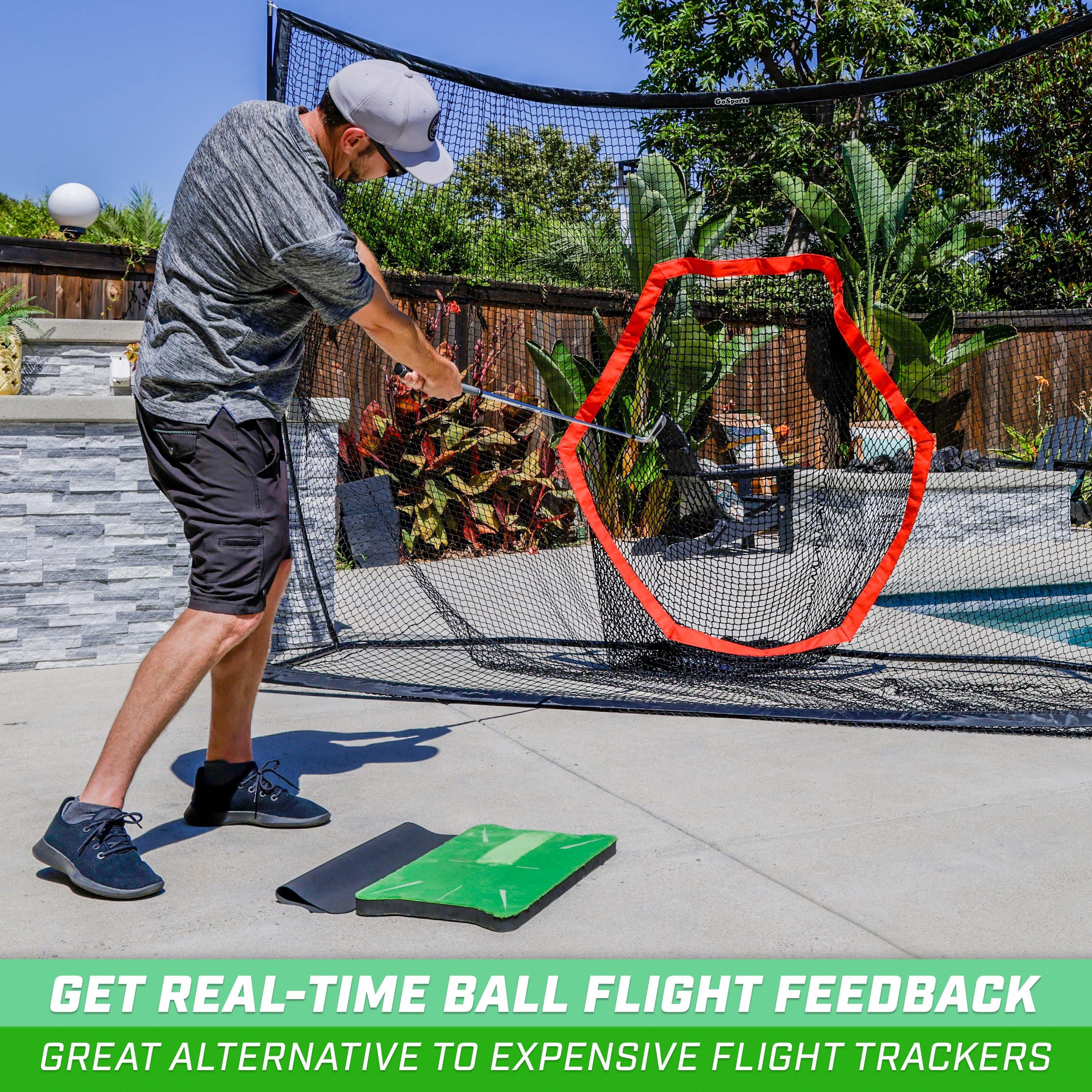 a man playing with a net on the backyard