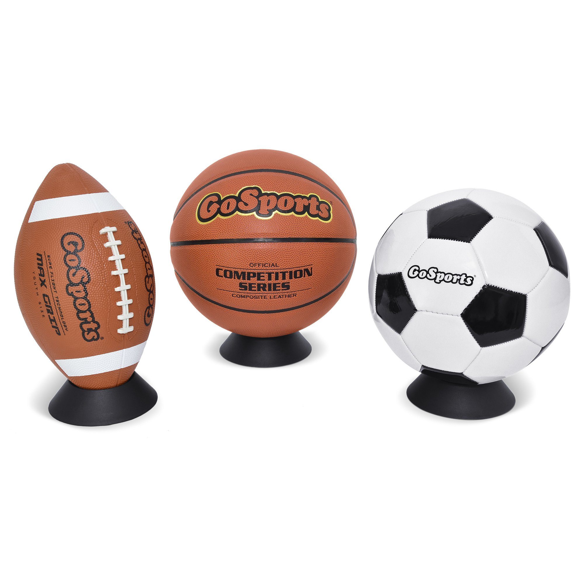 football on a black ball holder basketball in the middle on black ball holder soccer ball on right on black ball holder