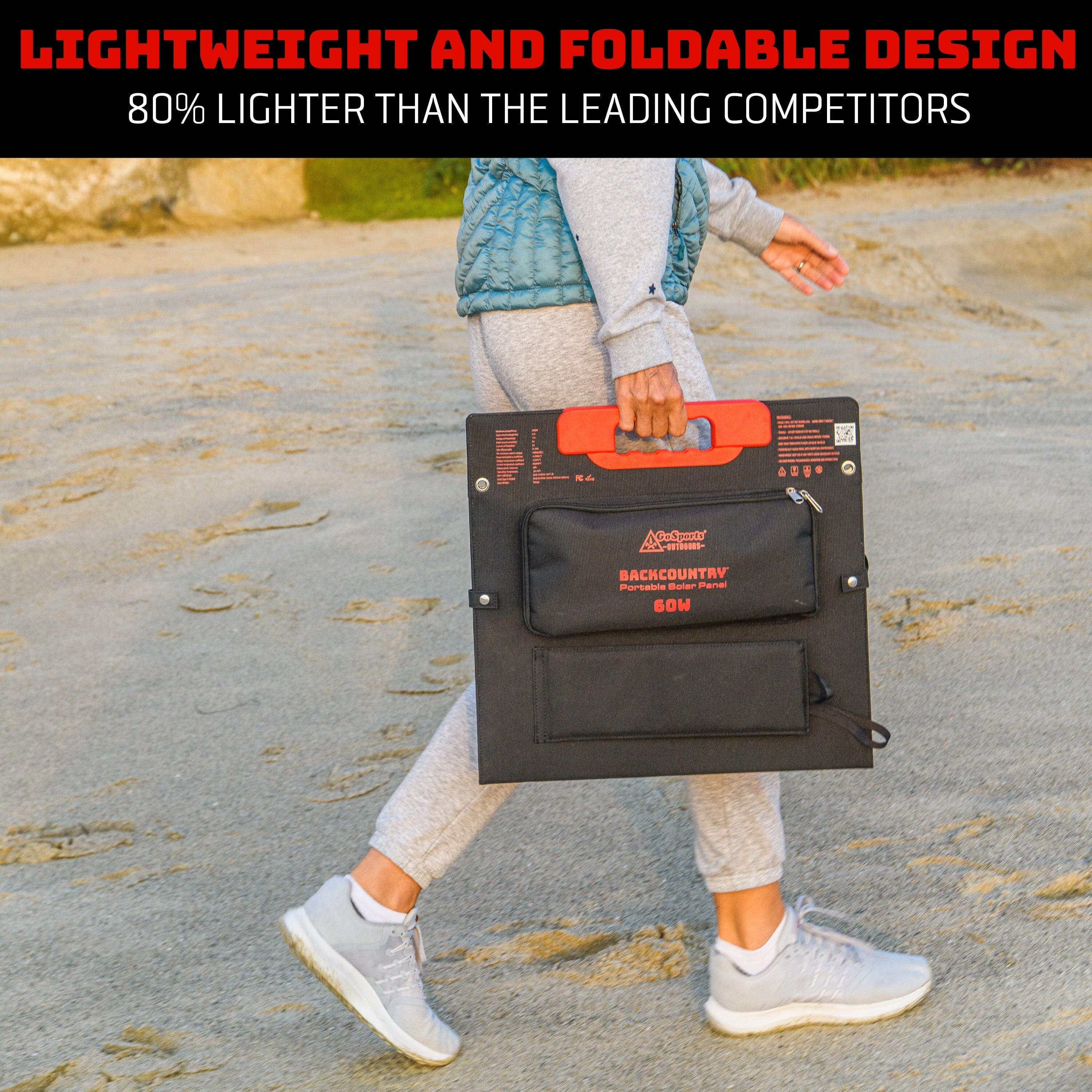 a woman walking down a beach with solar panel