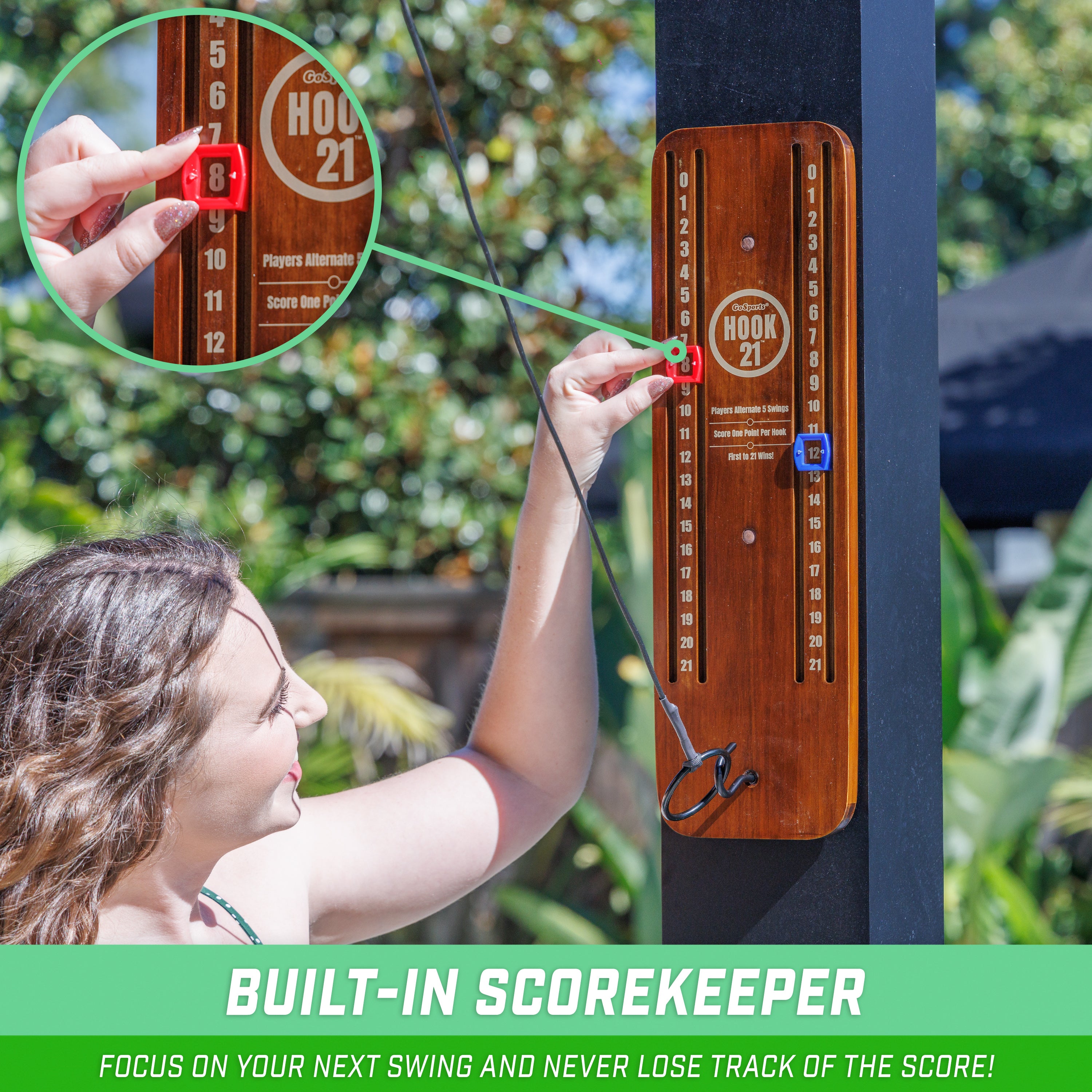 a woman is holding a red object in her hand