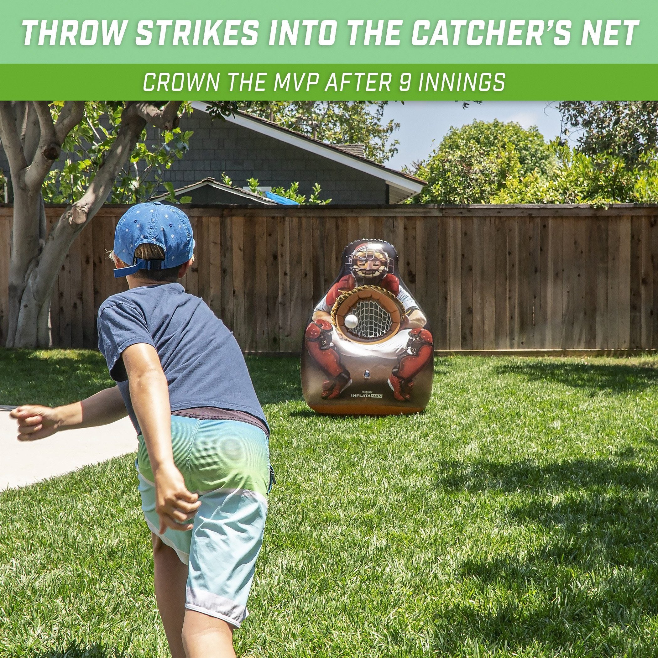 a young boy playing with a ball in the backyard