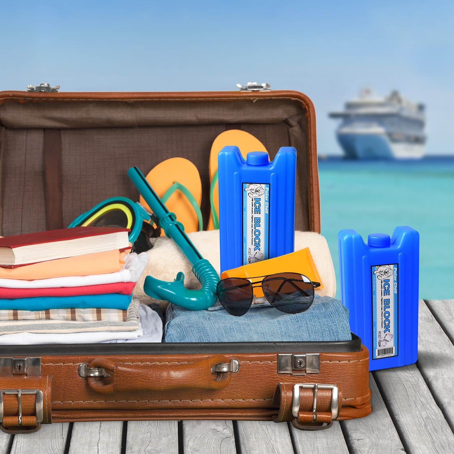 a suitcase filled with various items on a wooden table