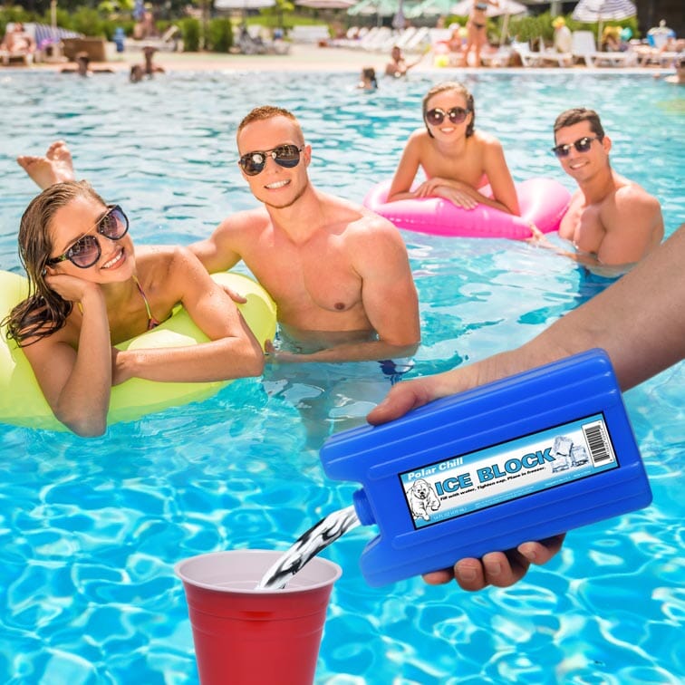 a group of people in a pool with a water gun