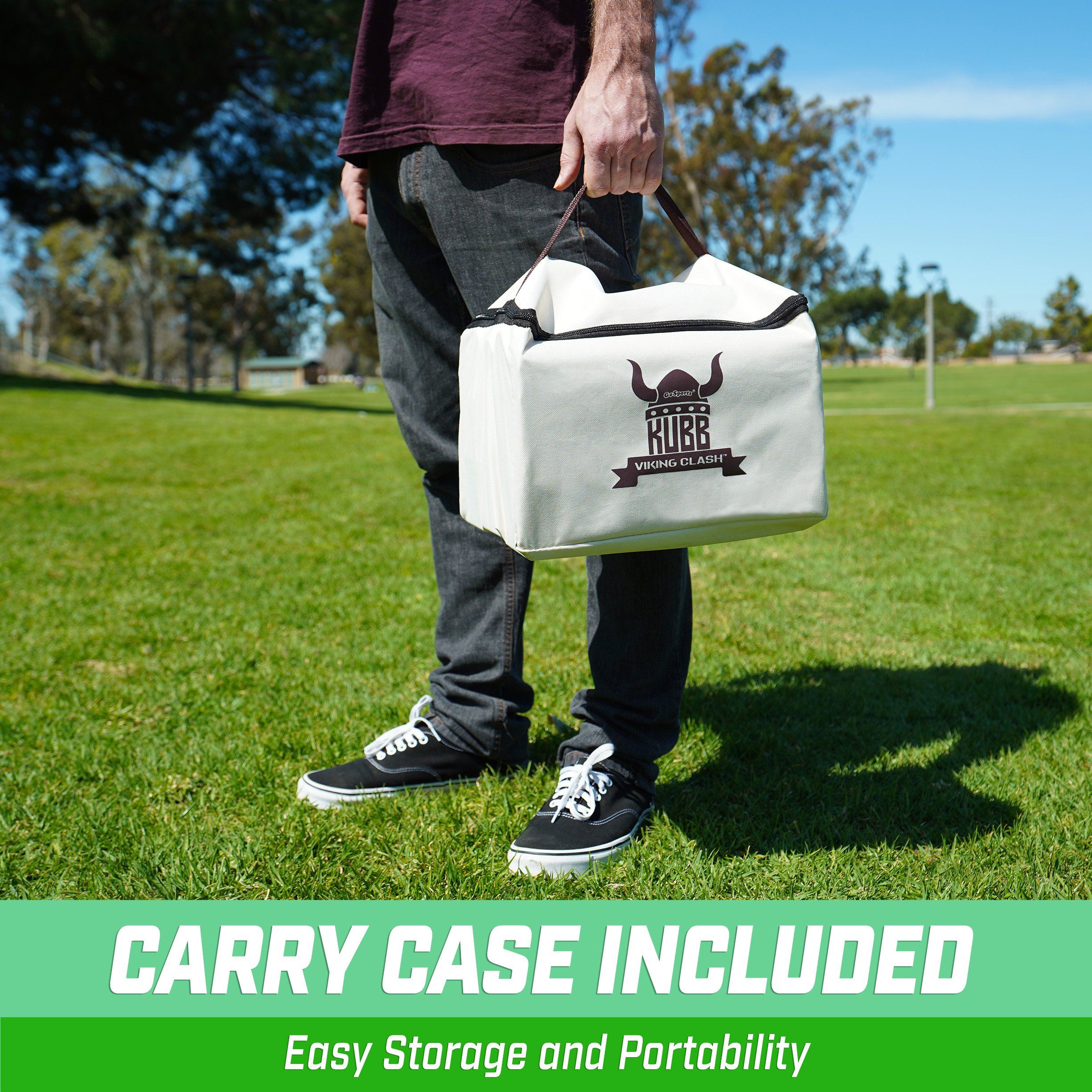 a man holding a white bag in a field