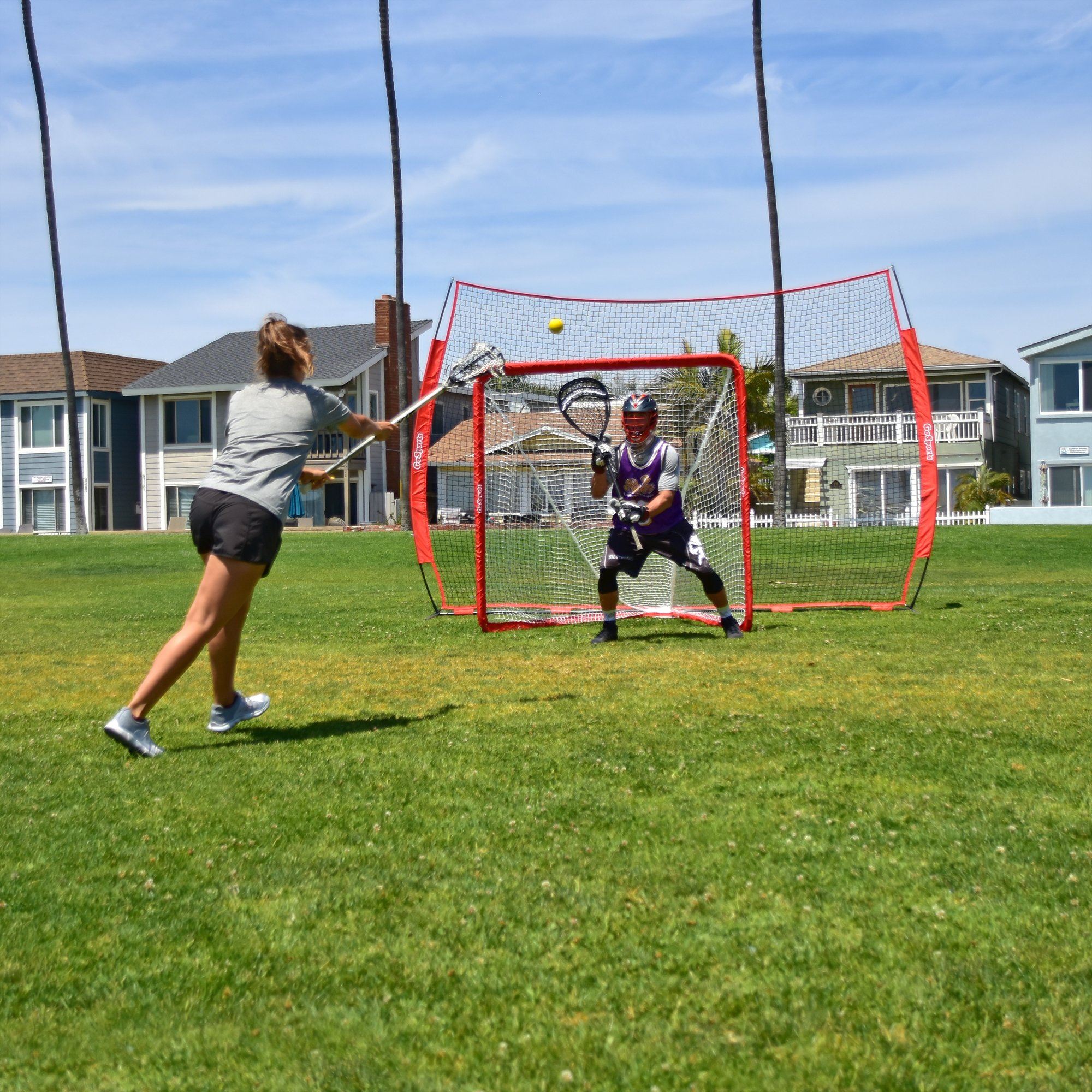 a woman hitting a ball with a tennis racket