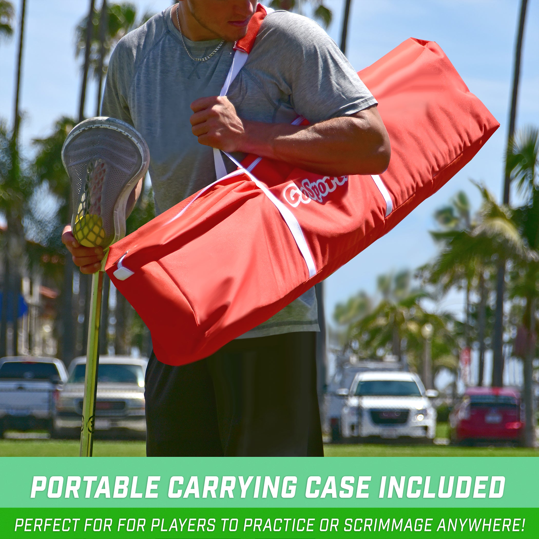 a man holding a red bag with a white stripe