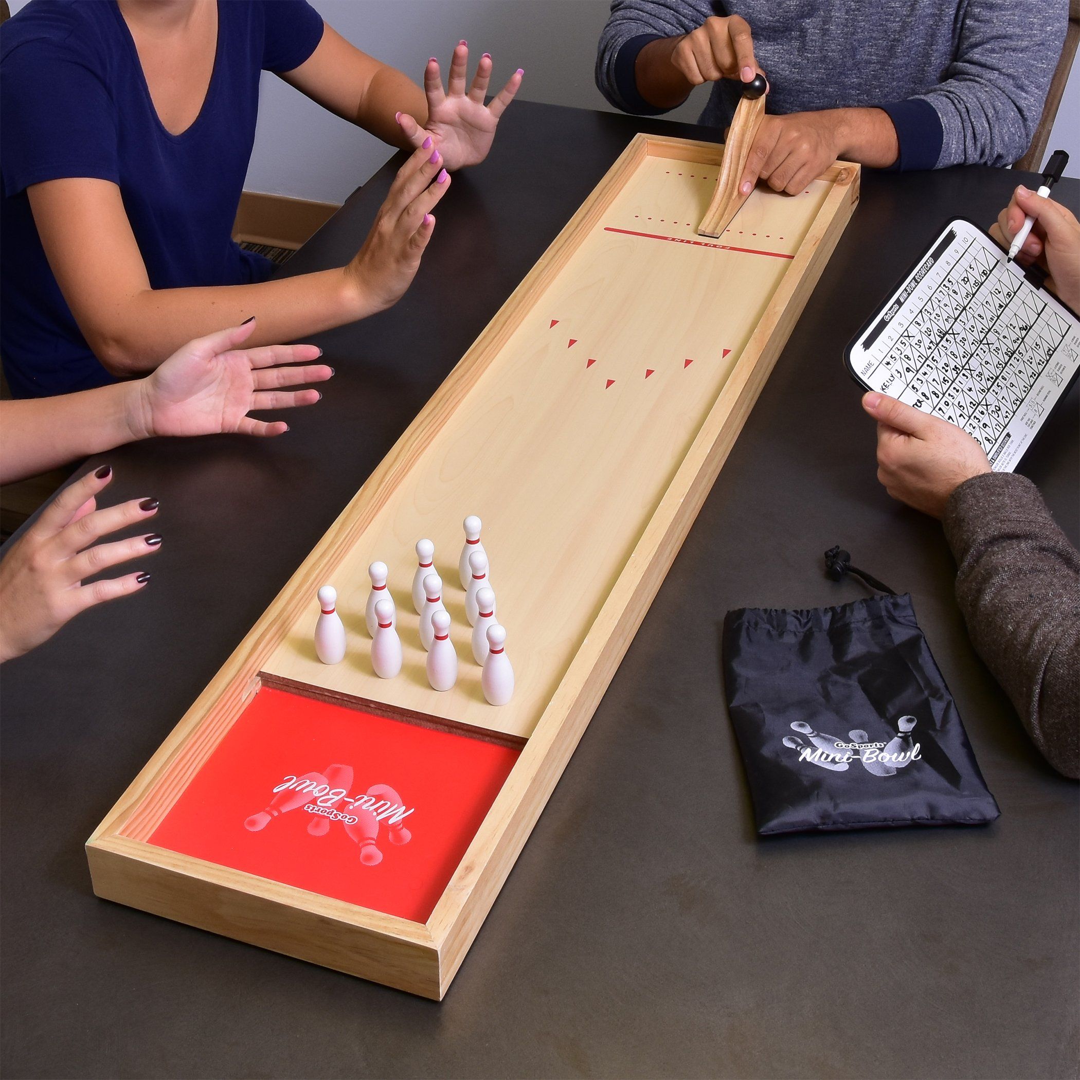 a group of people playing a game of bowling