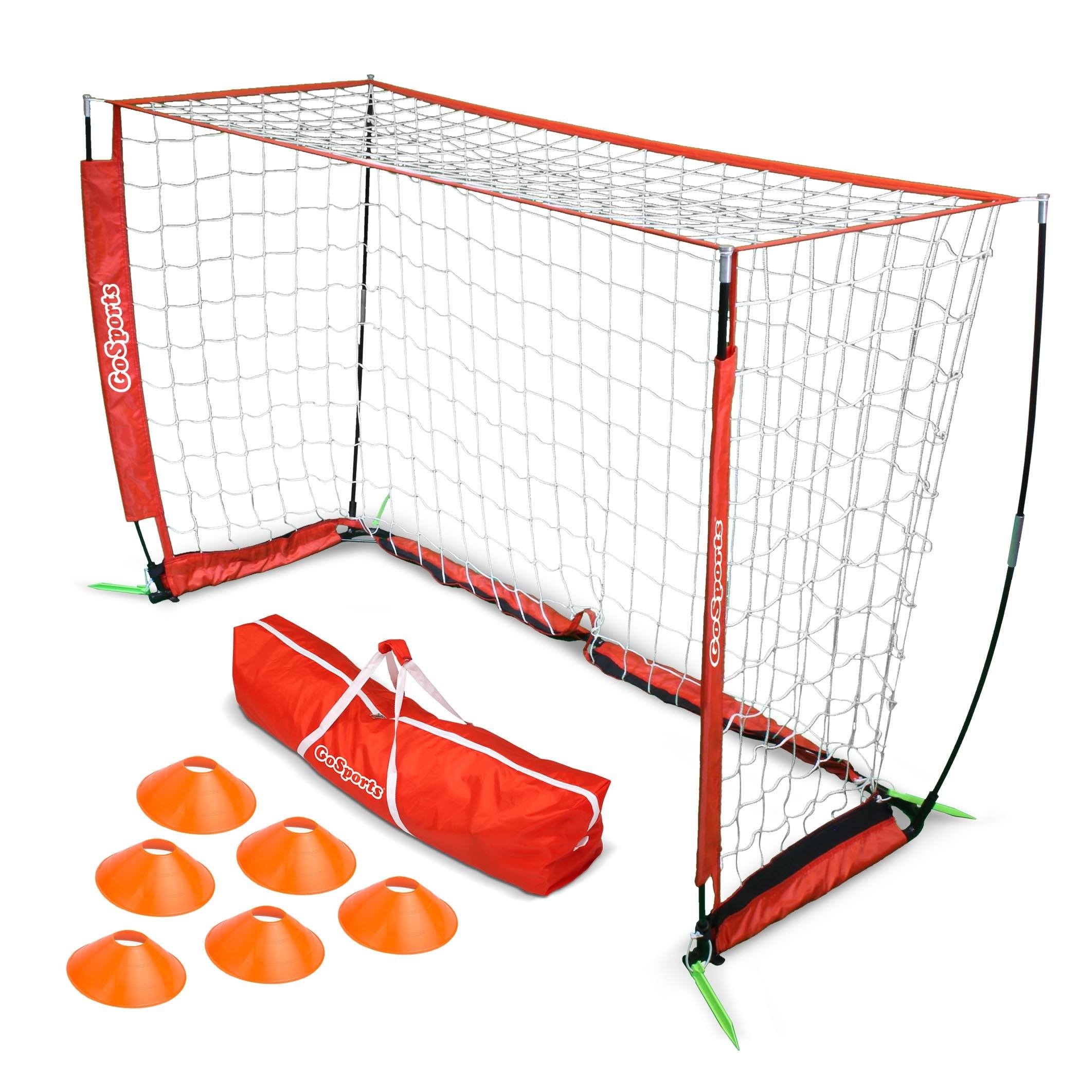 a soccer goal set with a bag and ball