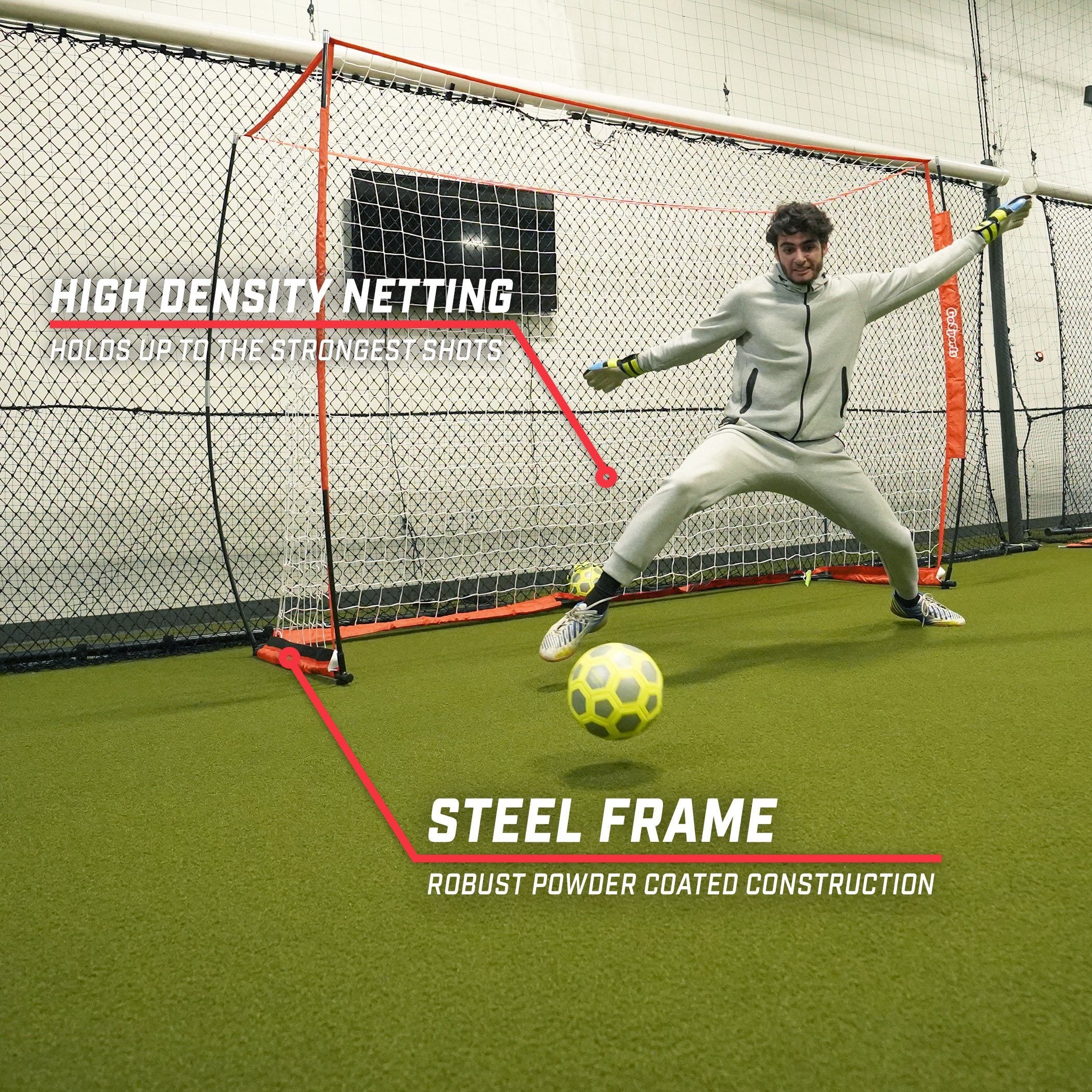 a man in a white suit kicking a soccer ball