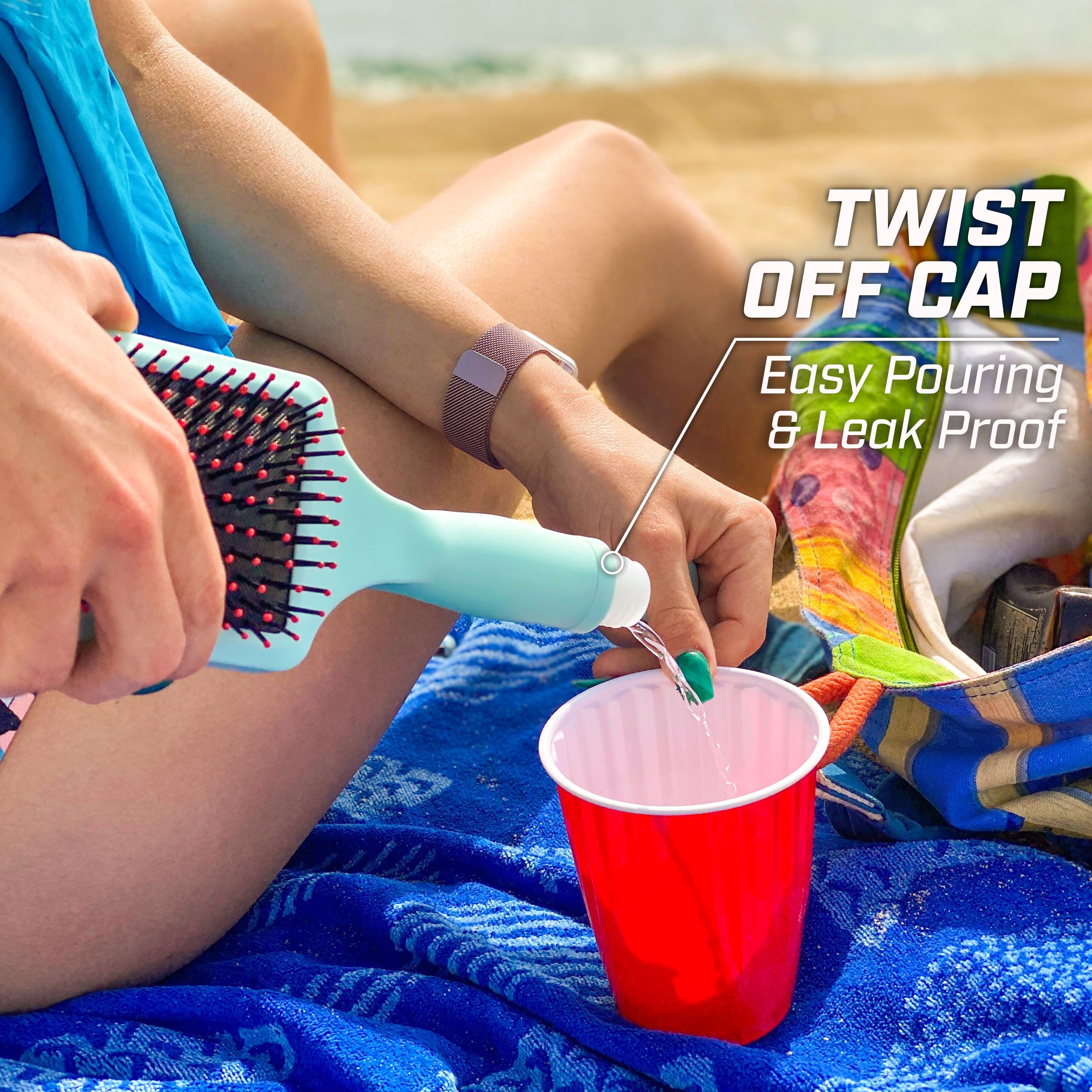 a woman sitting on a towel with a brush and a cup