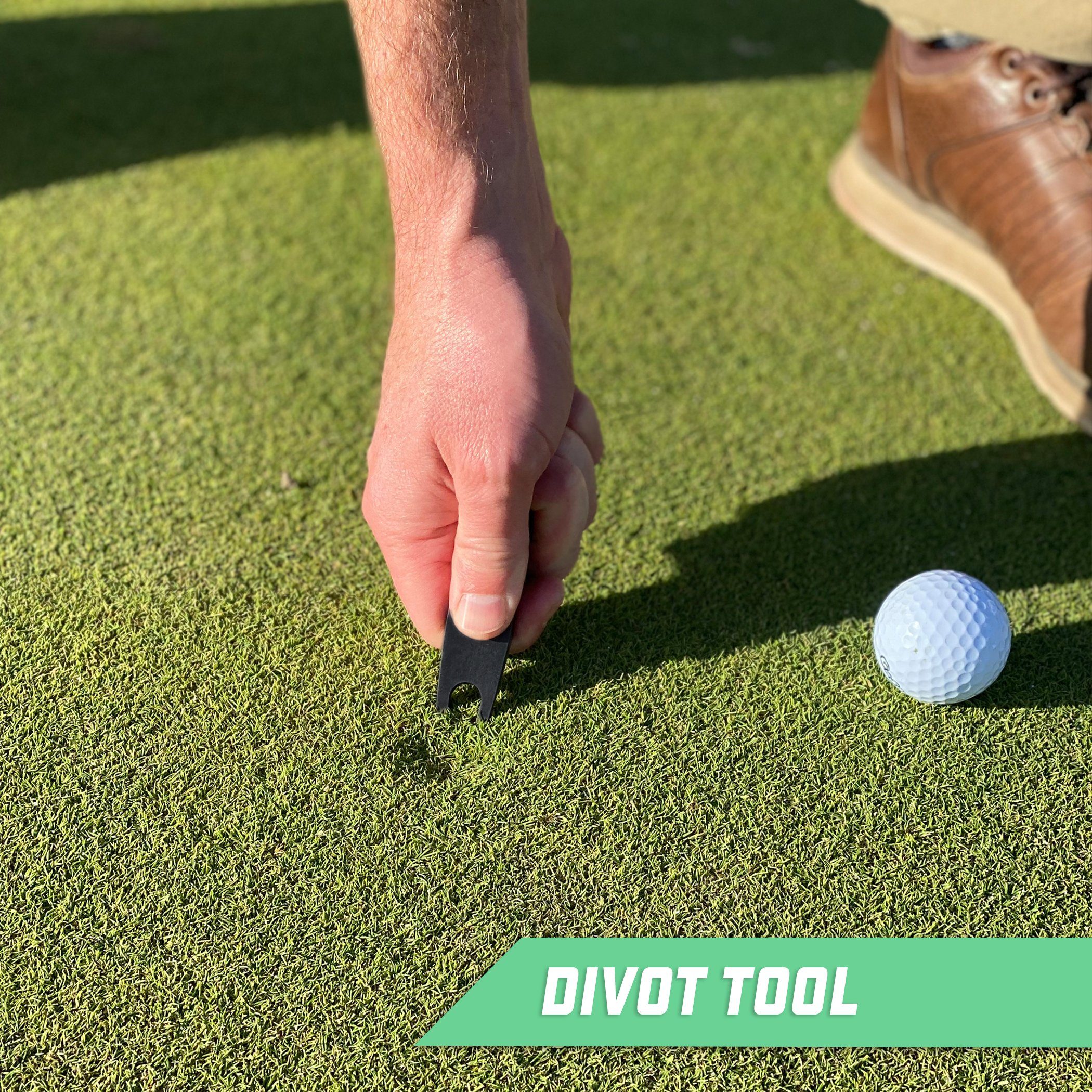 a man putting a golf ball on the green