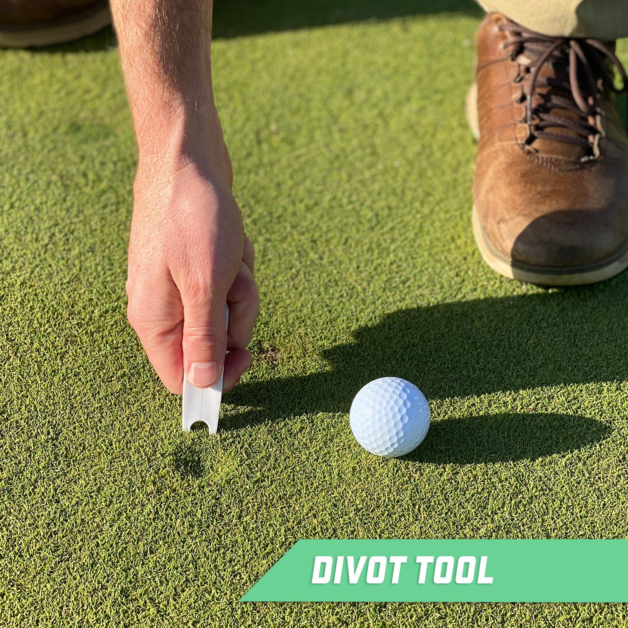 a man putting a golf ball on the green