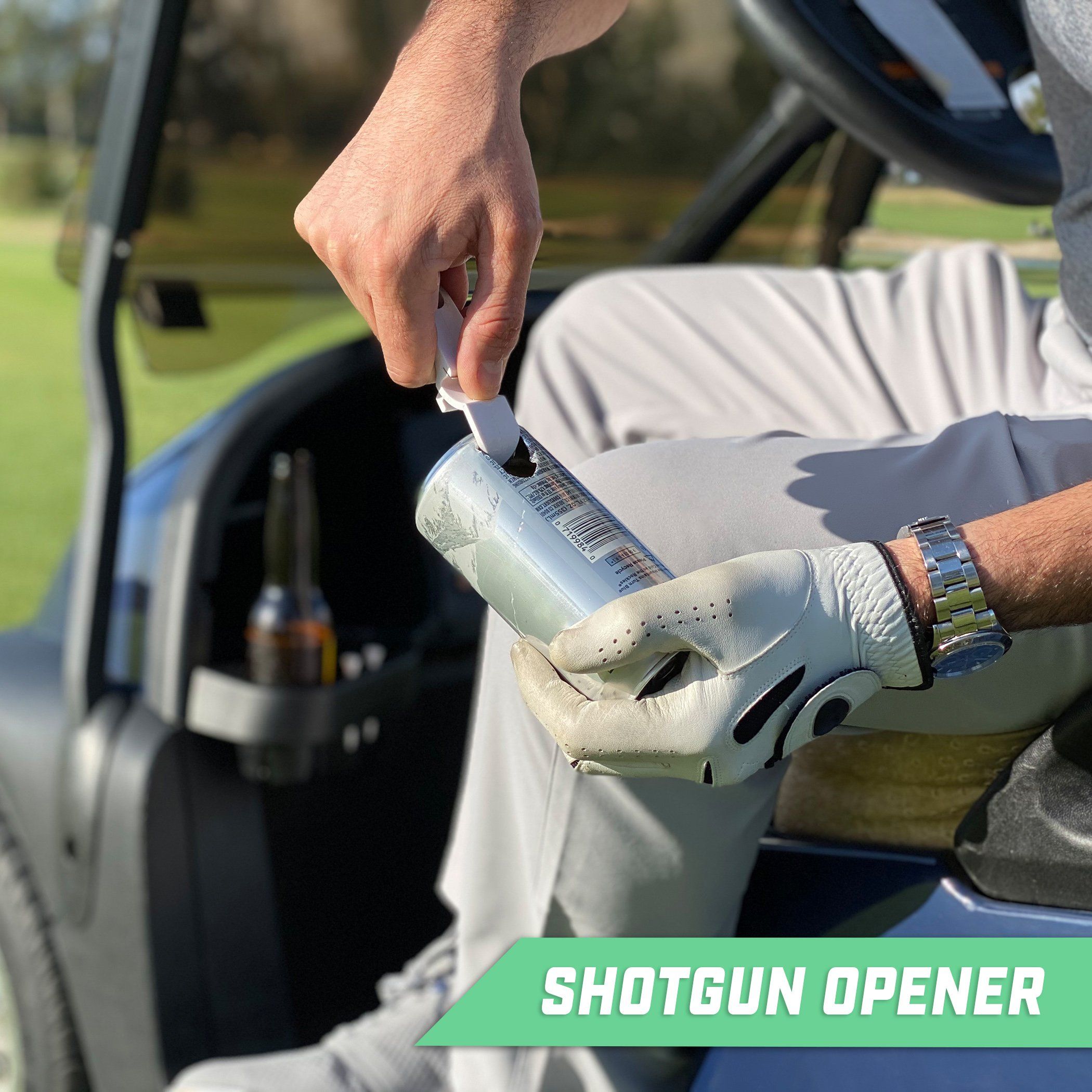 a man is holding a bottle of beer