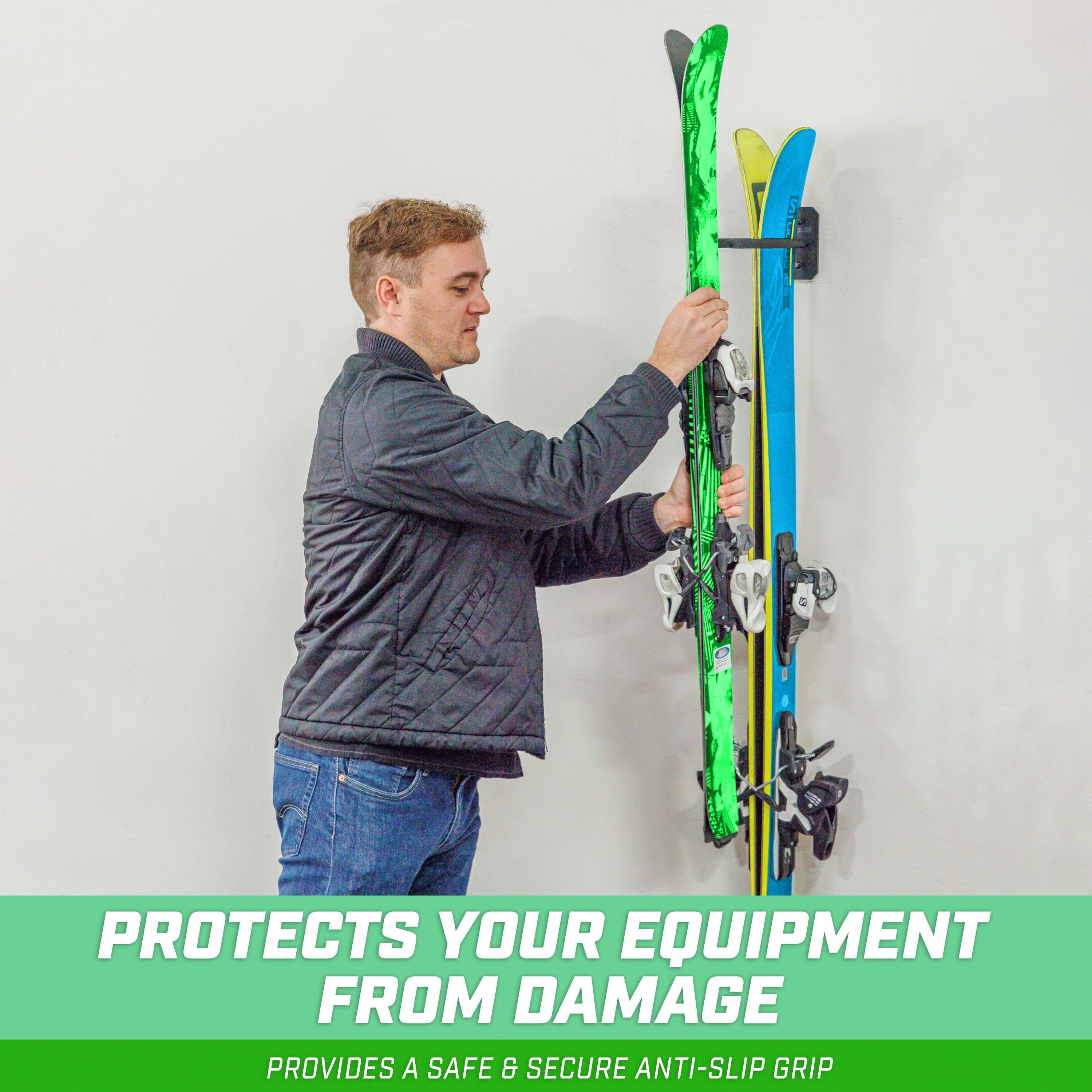 a man holding a snowboard with a snowboard attached to it