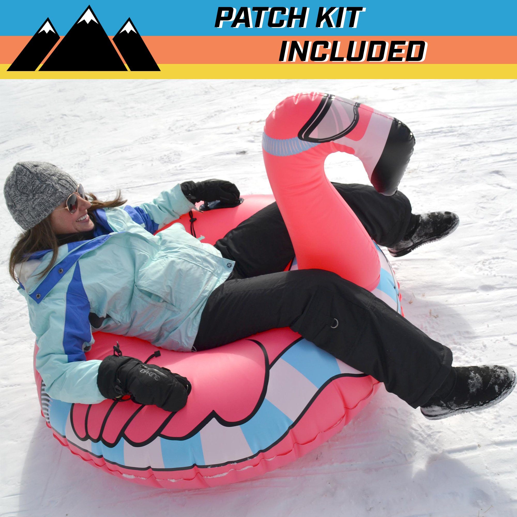 a girl laying on a pink snow tube