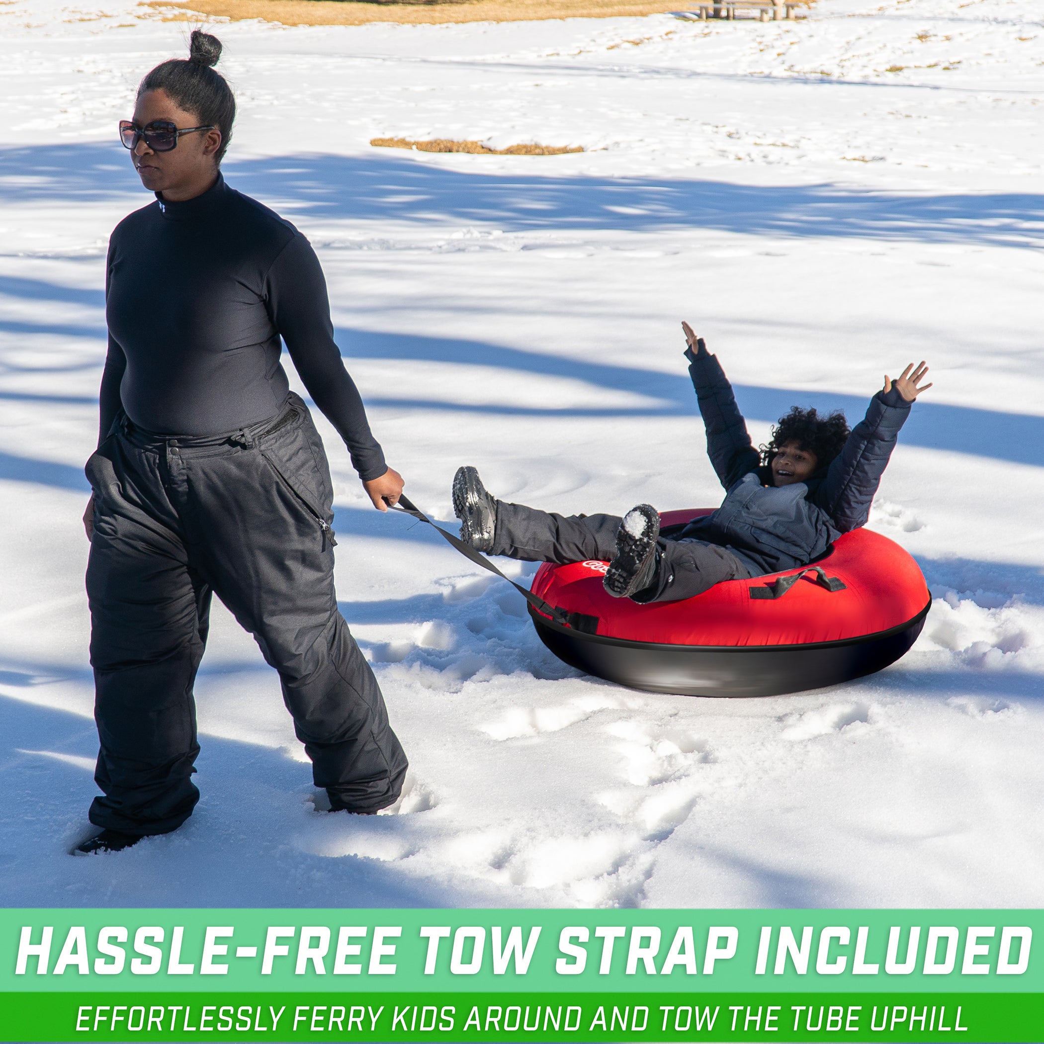 a man and a boy sled down a hill