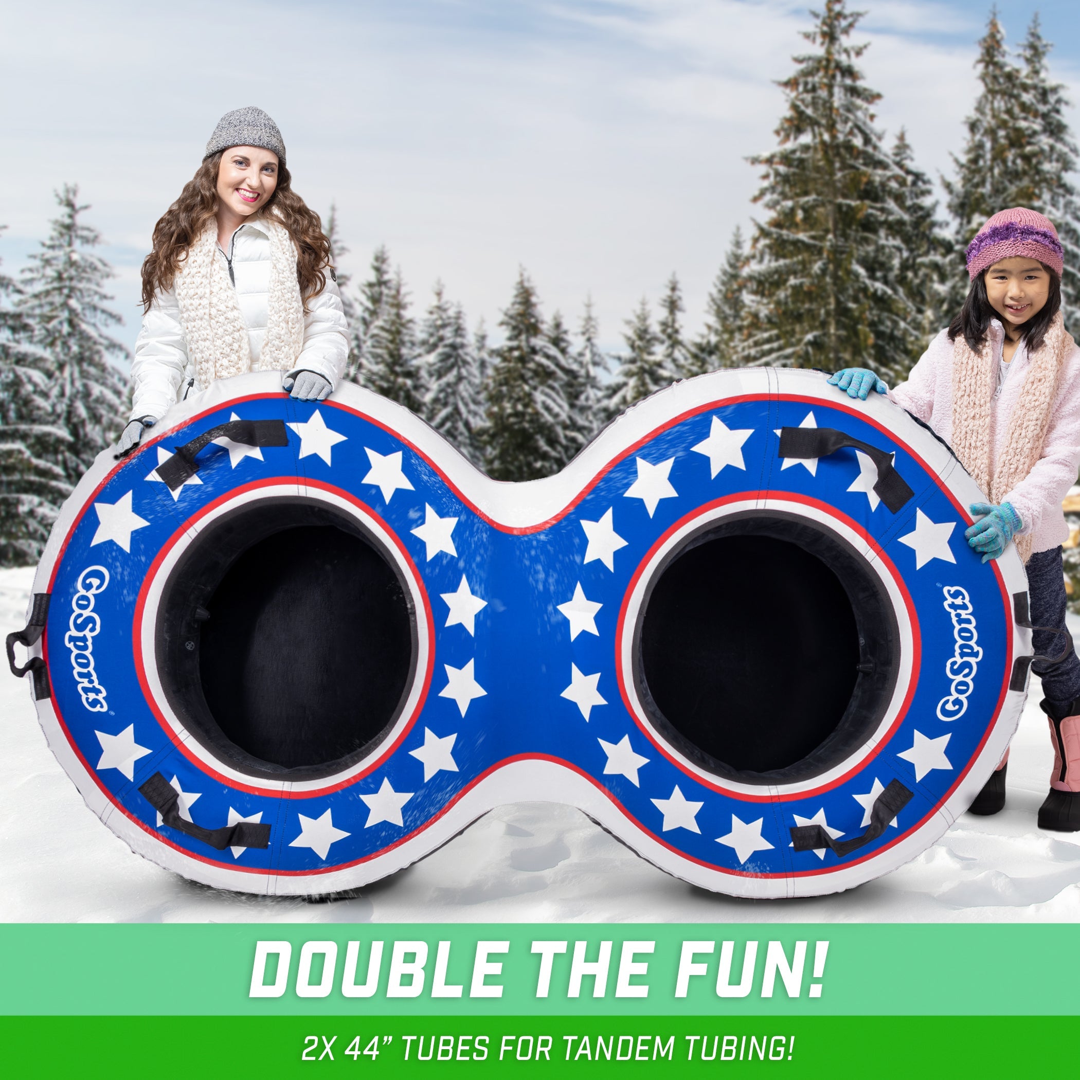two girls sitting on a snow tube