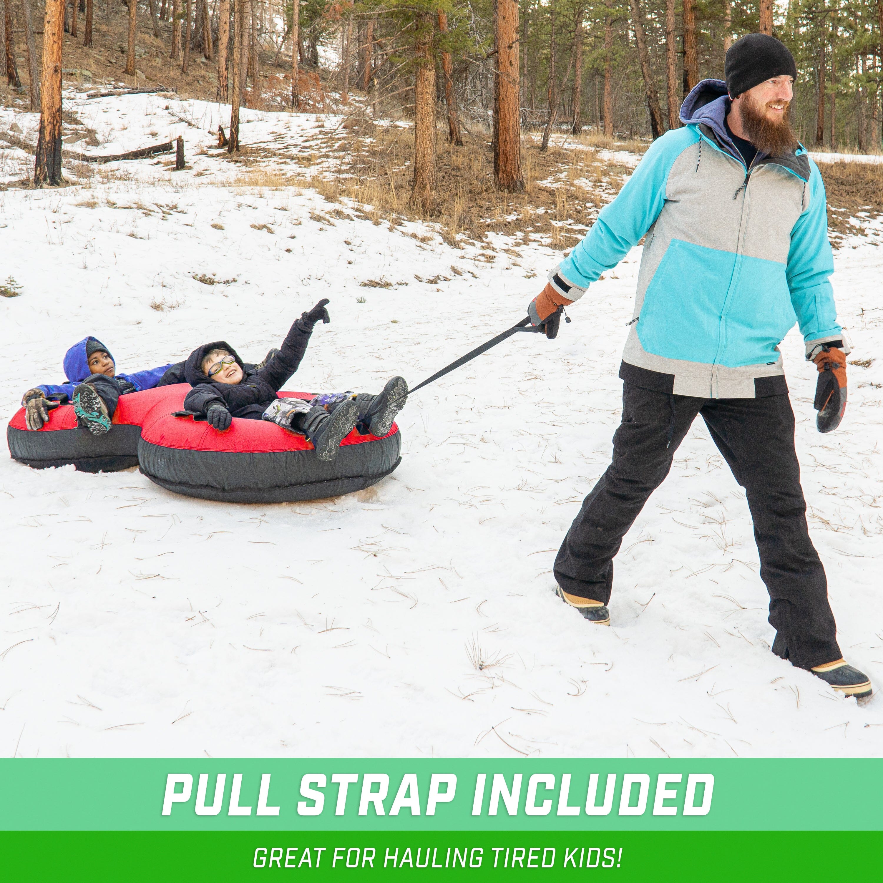 a man pulling a child on a sler