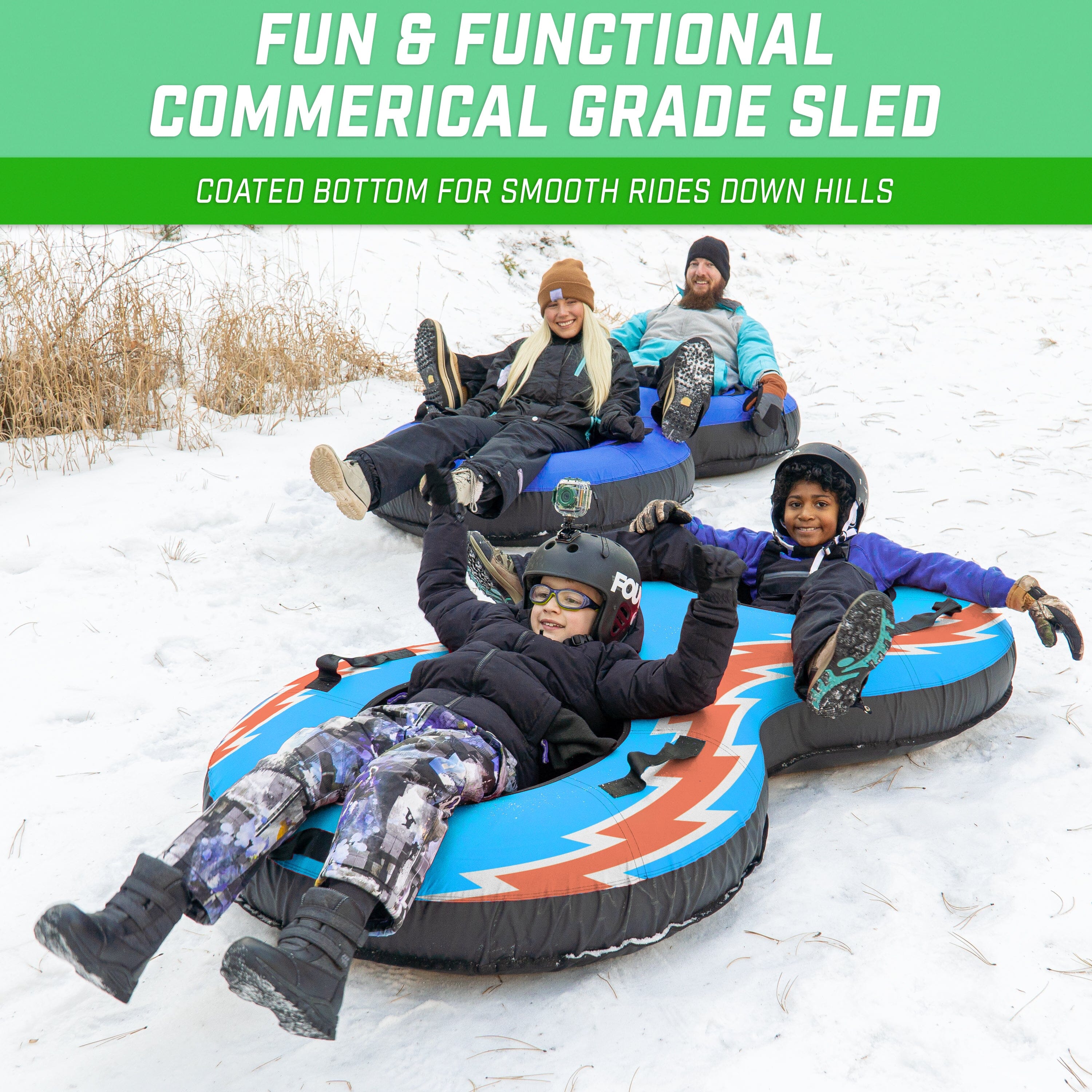 two adults on a blue inflatable snow tube 2 children on top of inflatable snow tube