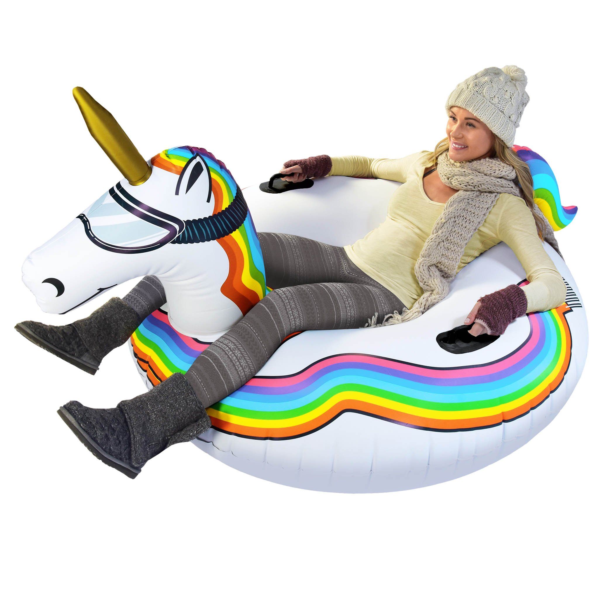 a woman sitting on an inflatable unicorn