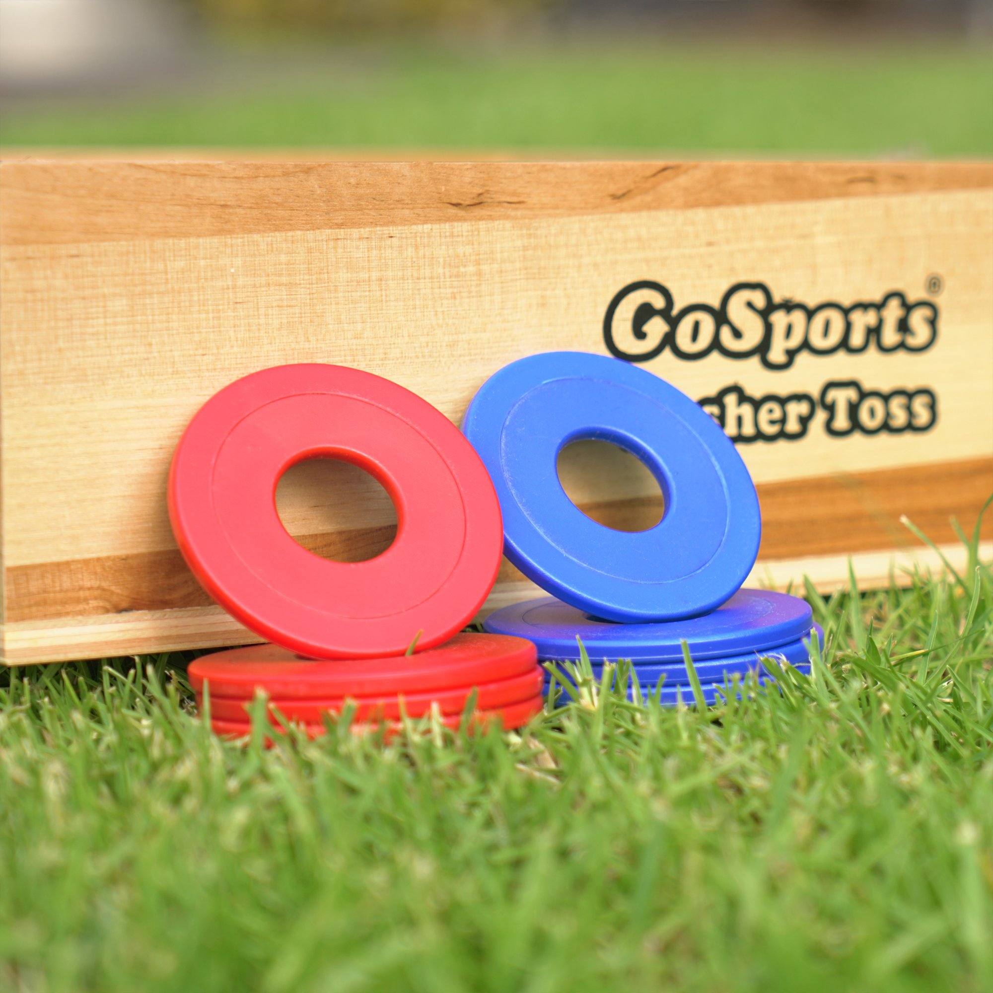 a wooden box with three plastic rings on it
