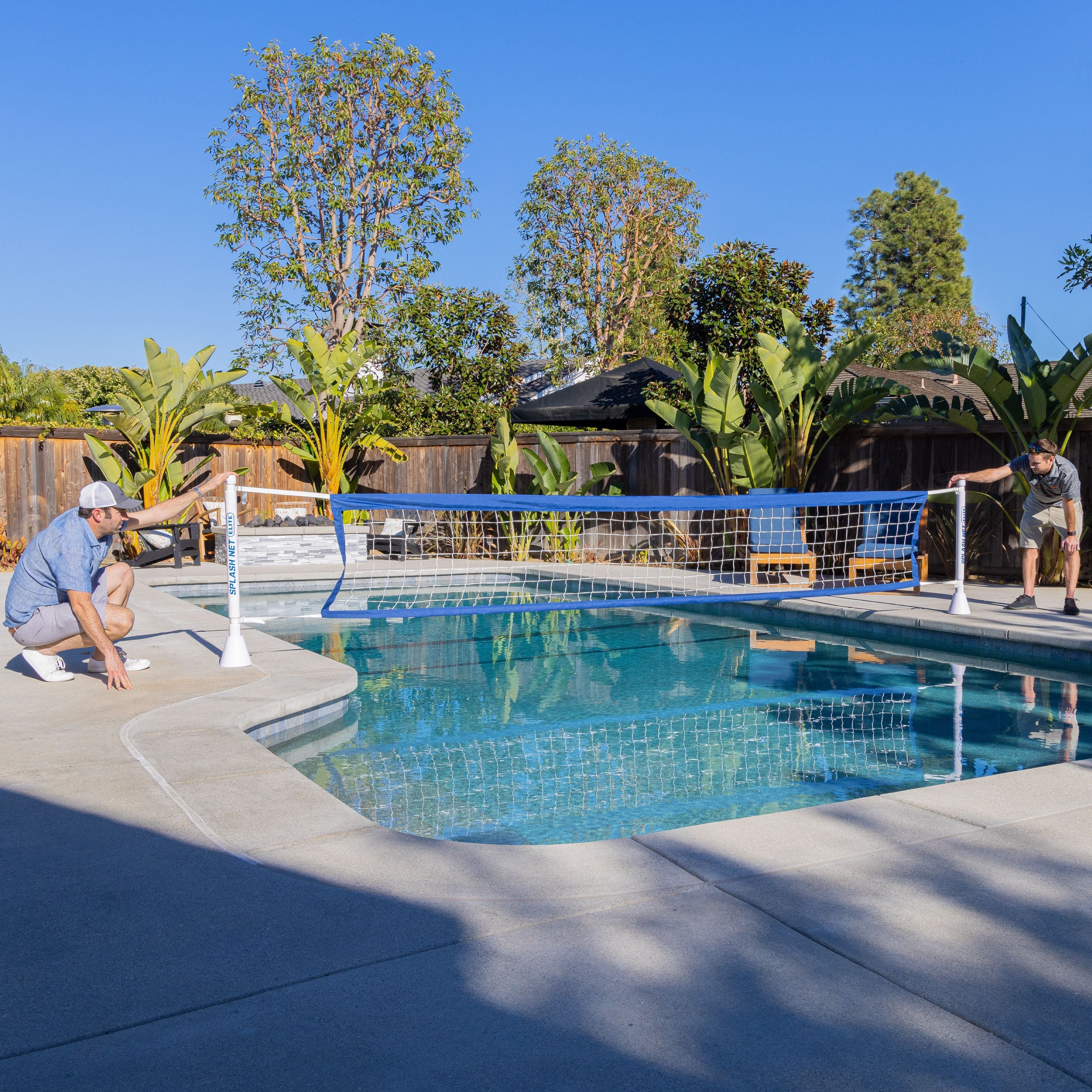 a man is playing volleyball in a pool