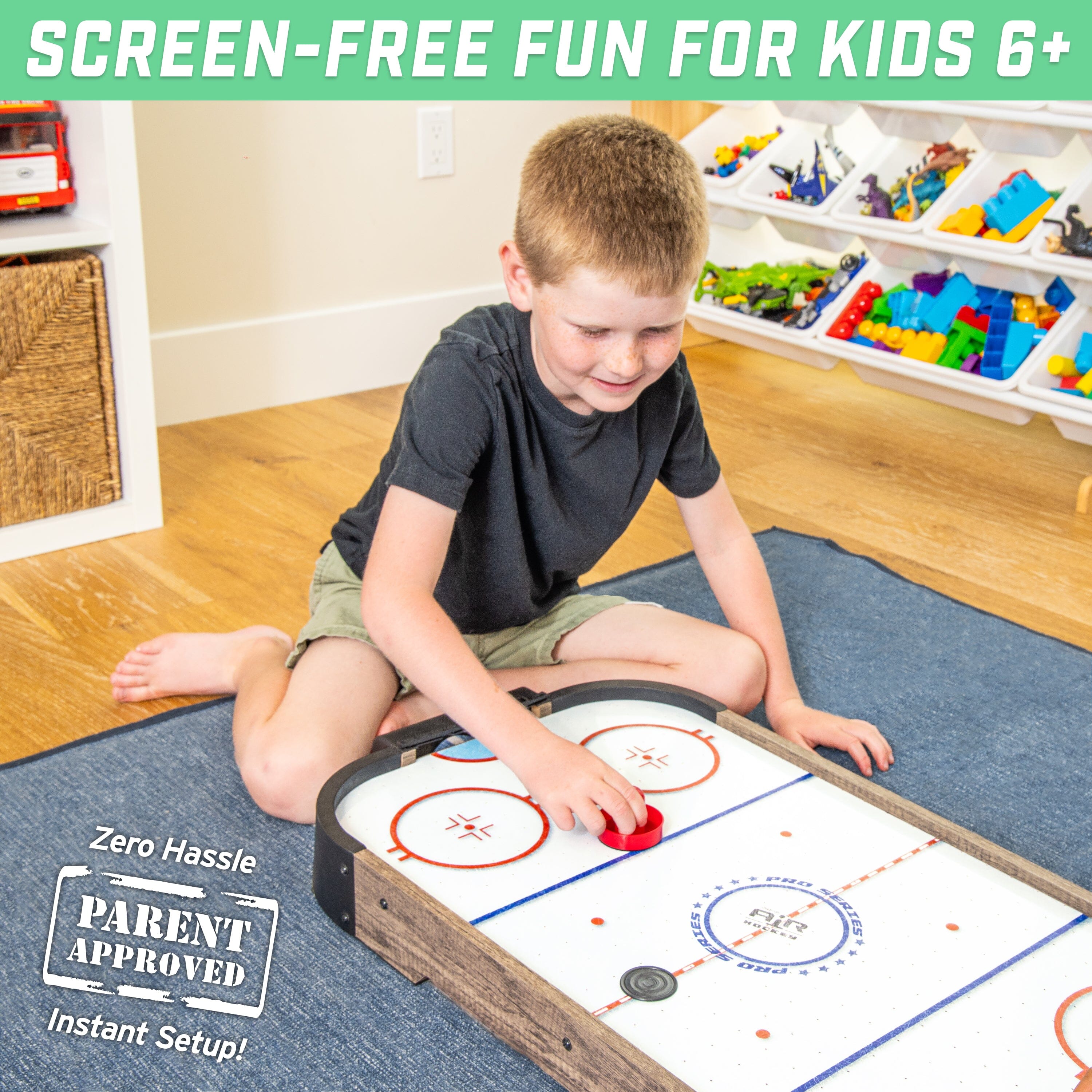 a young boy playing with a hockey board