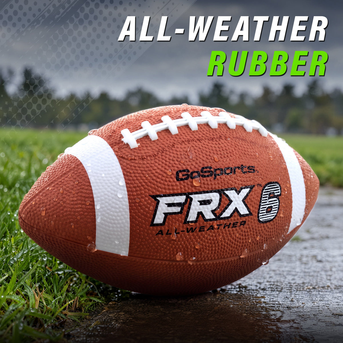 Water beading on a GoSports FRX 6 all-weather rubber football resting on wet grass