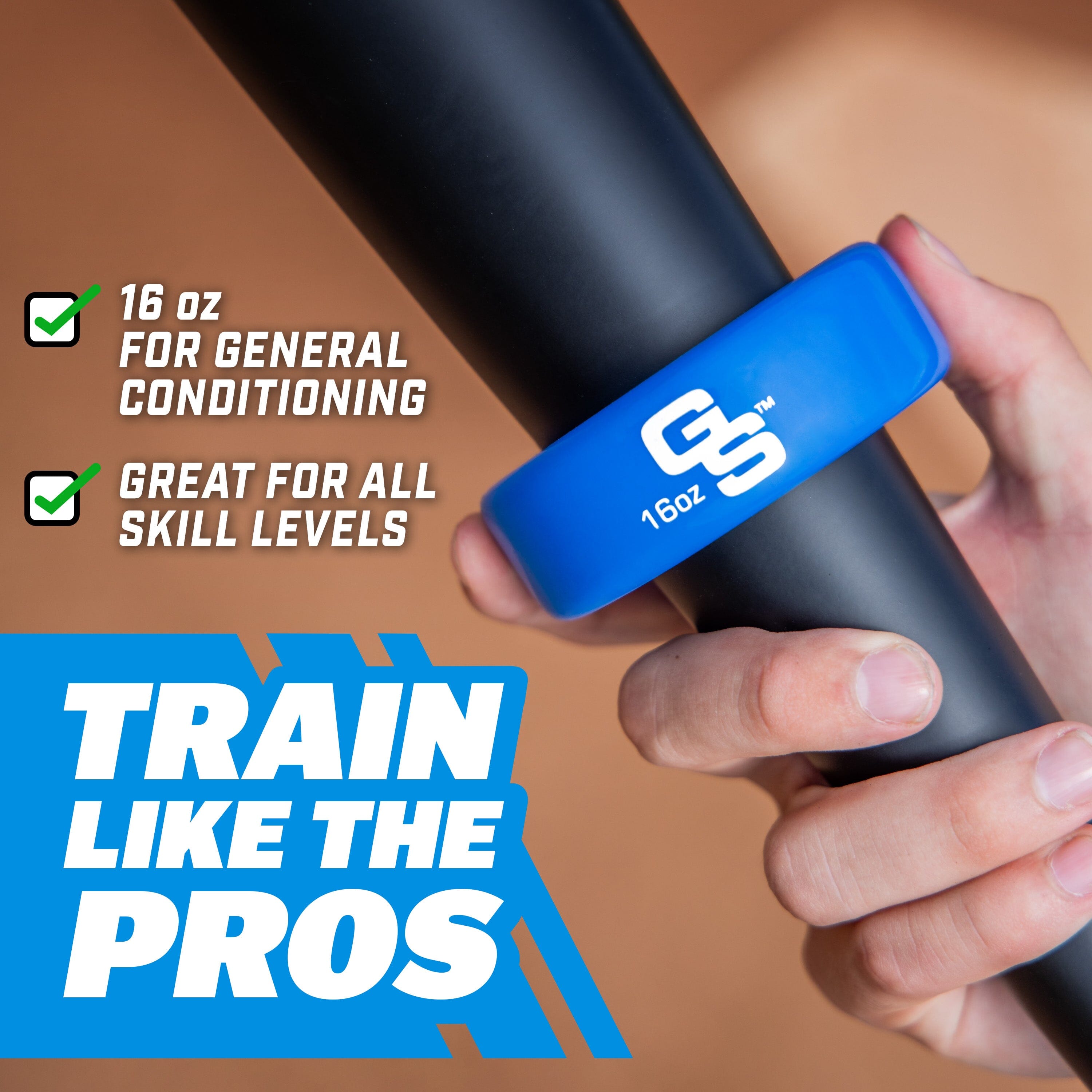 Hand holding a black resistance band with a blue GS branded handle, on a brown background.