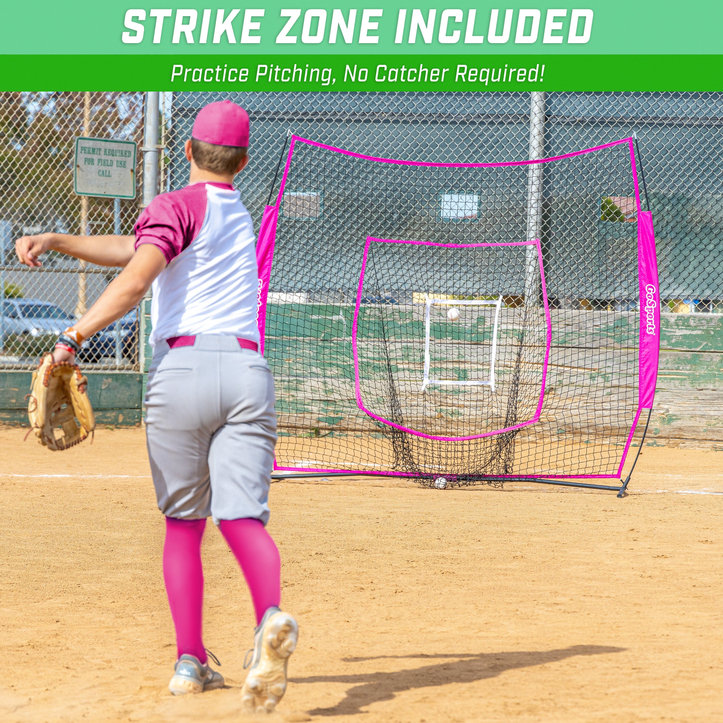 a woman in a pink hat is swinging a baseball bat