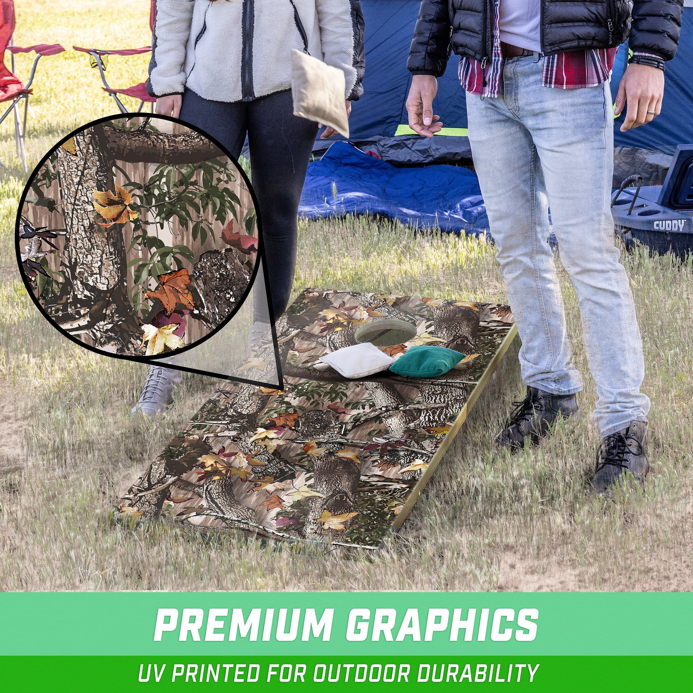 a couple standing next to a tent with a bird on it