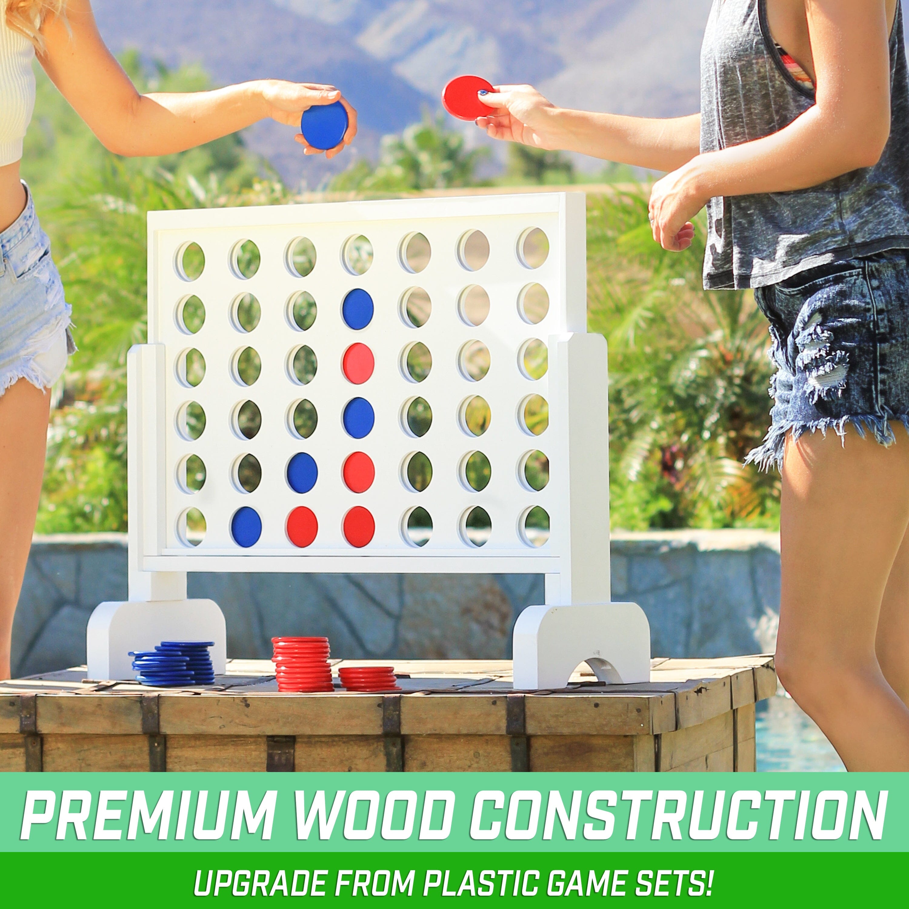 two girls playing a game of giant connect