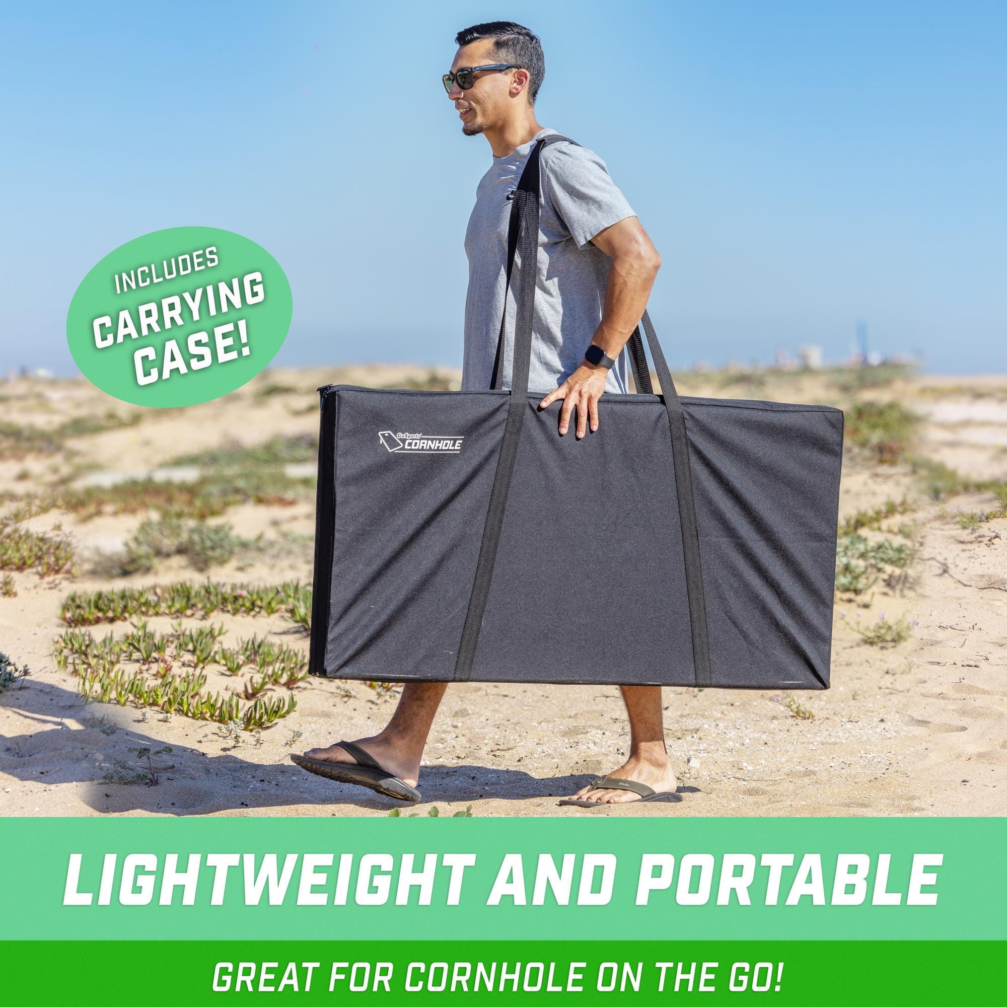 a man carrying a large bag on the beach