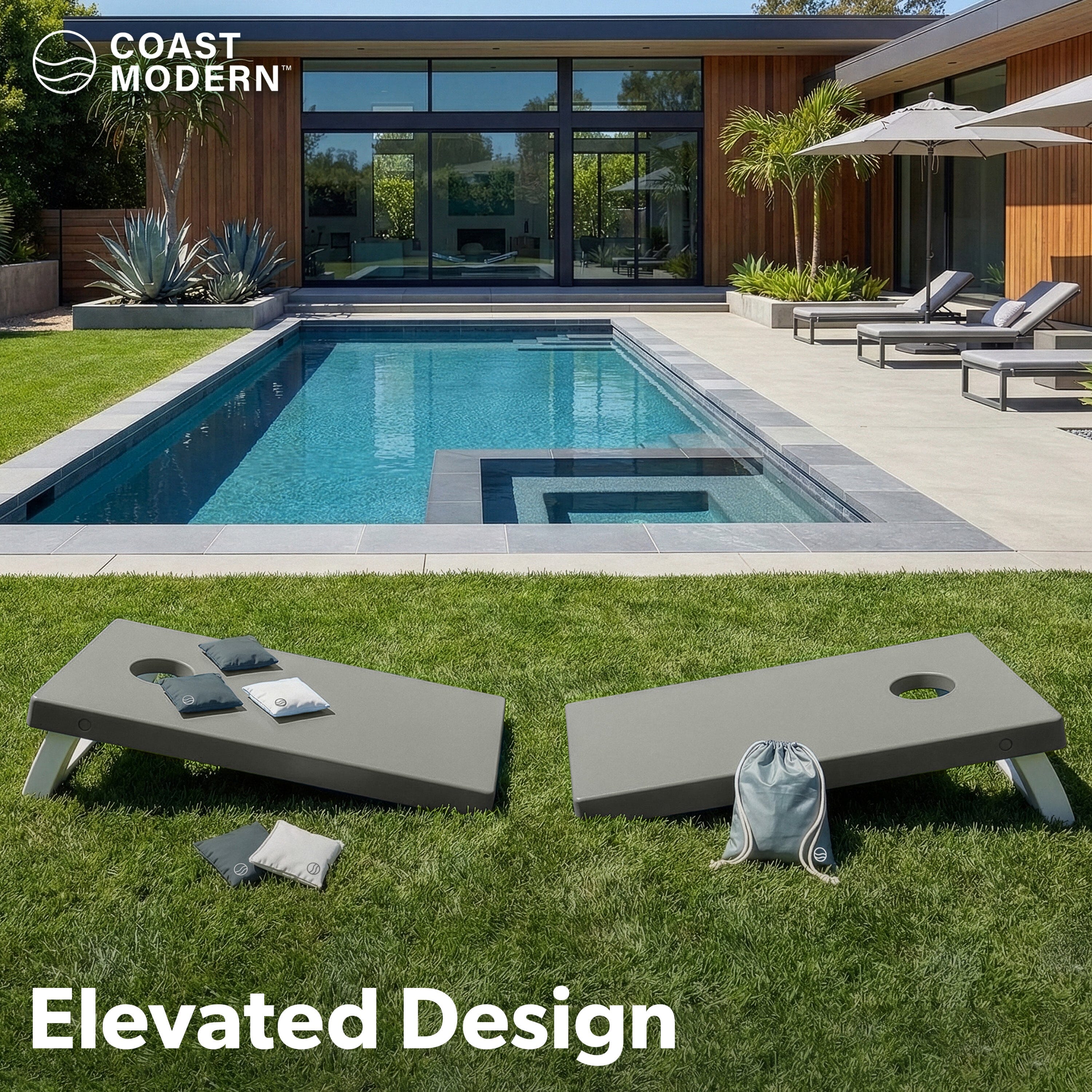 Modern outdoor setting with pool, lounge chairs, gray cornhole in the front, and 'Coast Modern' branding.