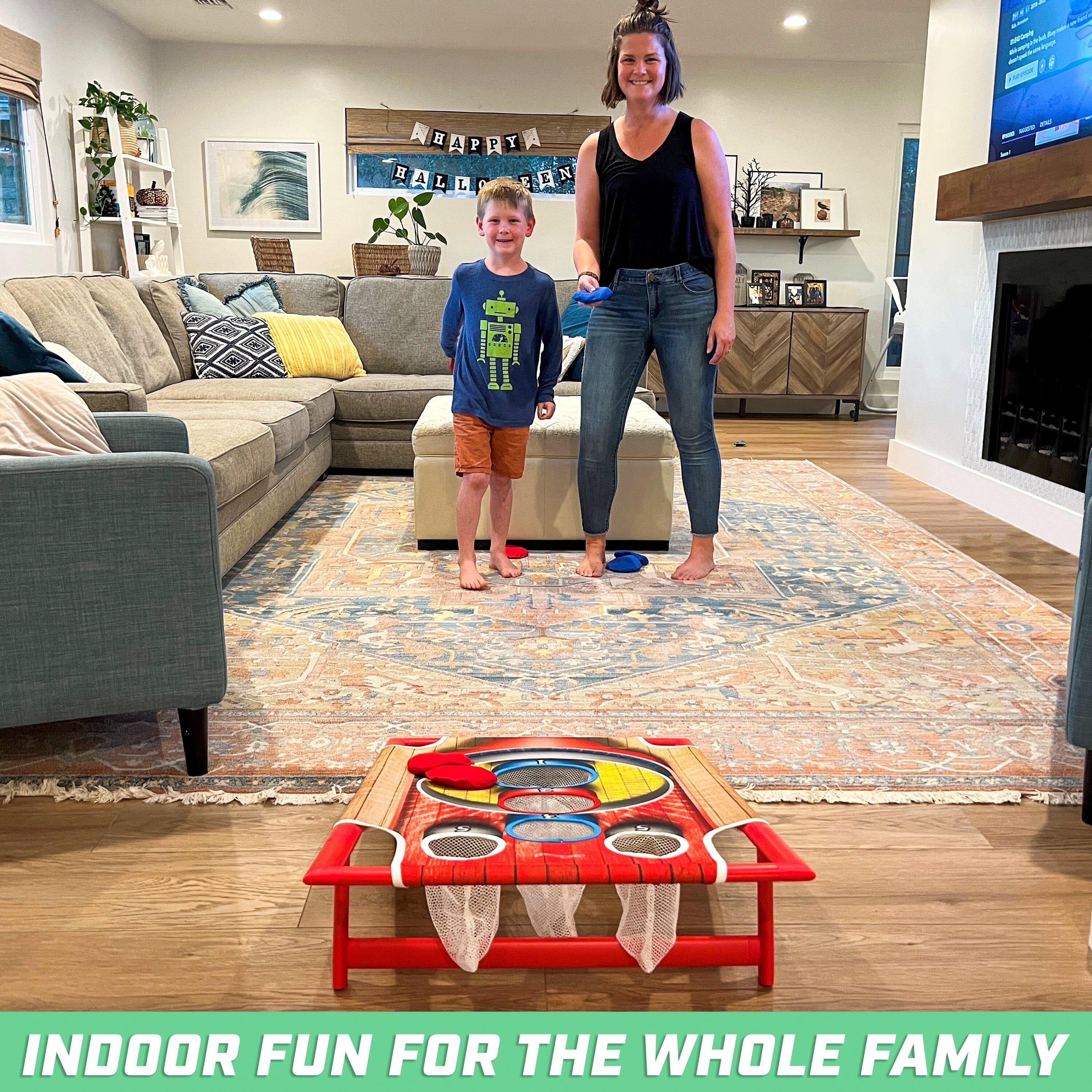 a woman and a child playing with a toy