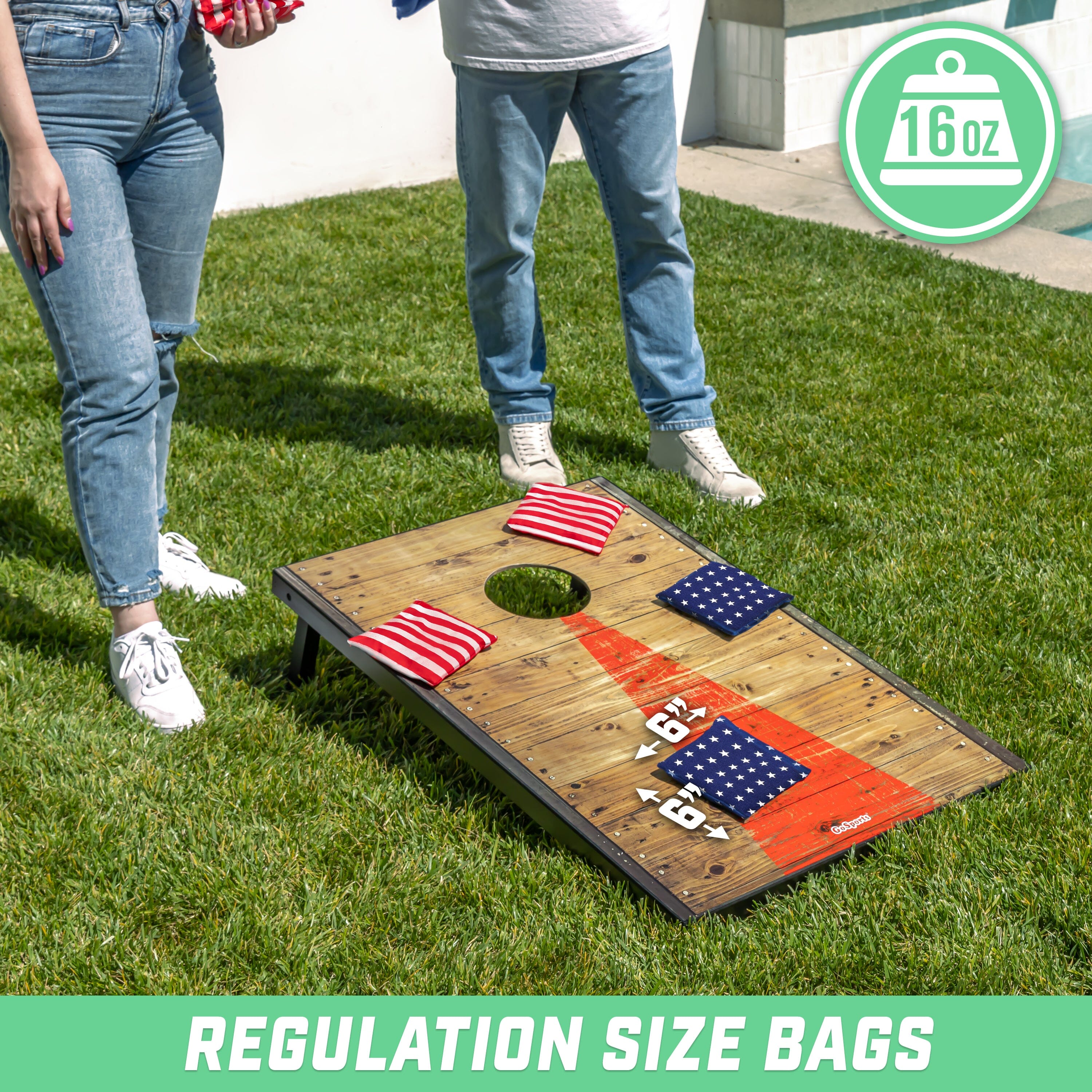 two people playing corno game on grass