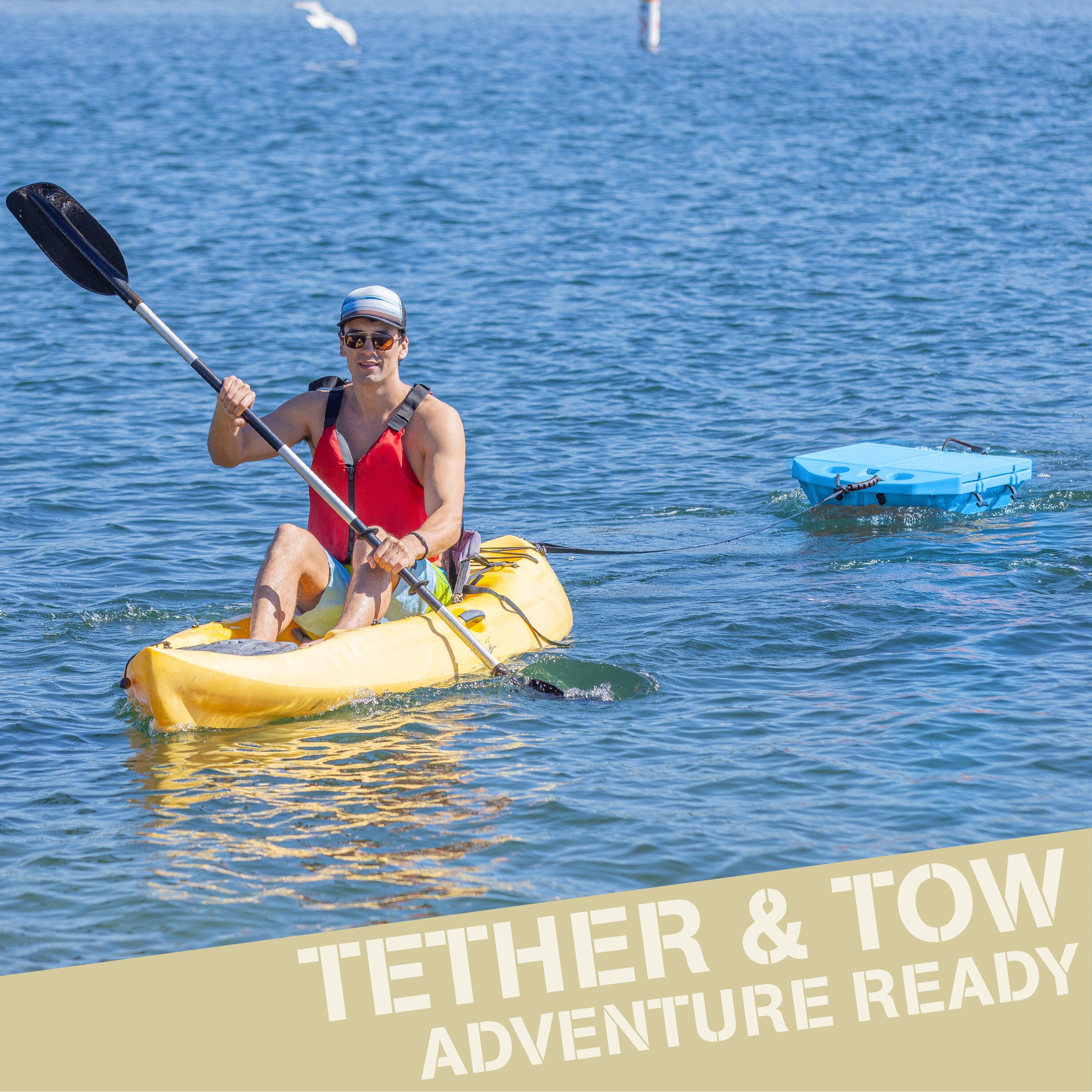 a man in a kayak paddles in the water