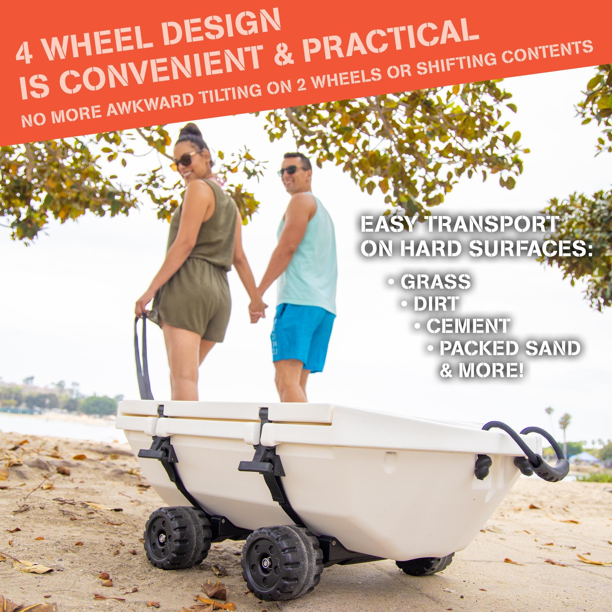 man and woman pulling cuddy cooler with wheels on sand