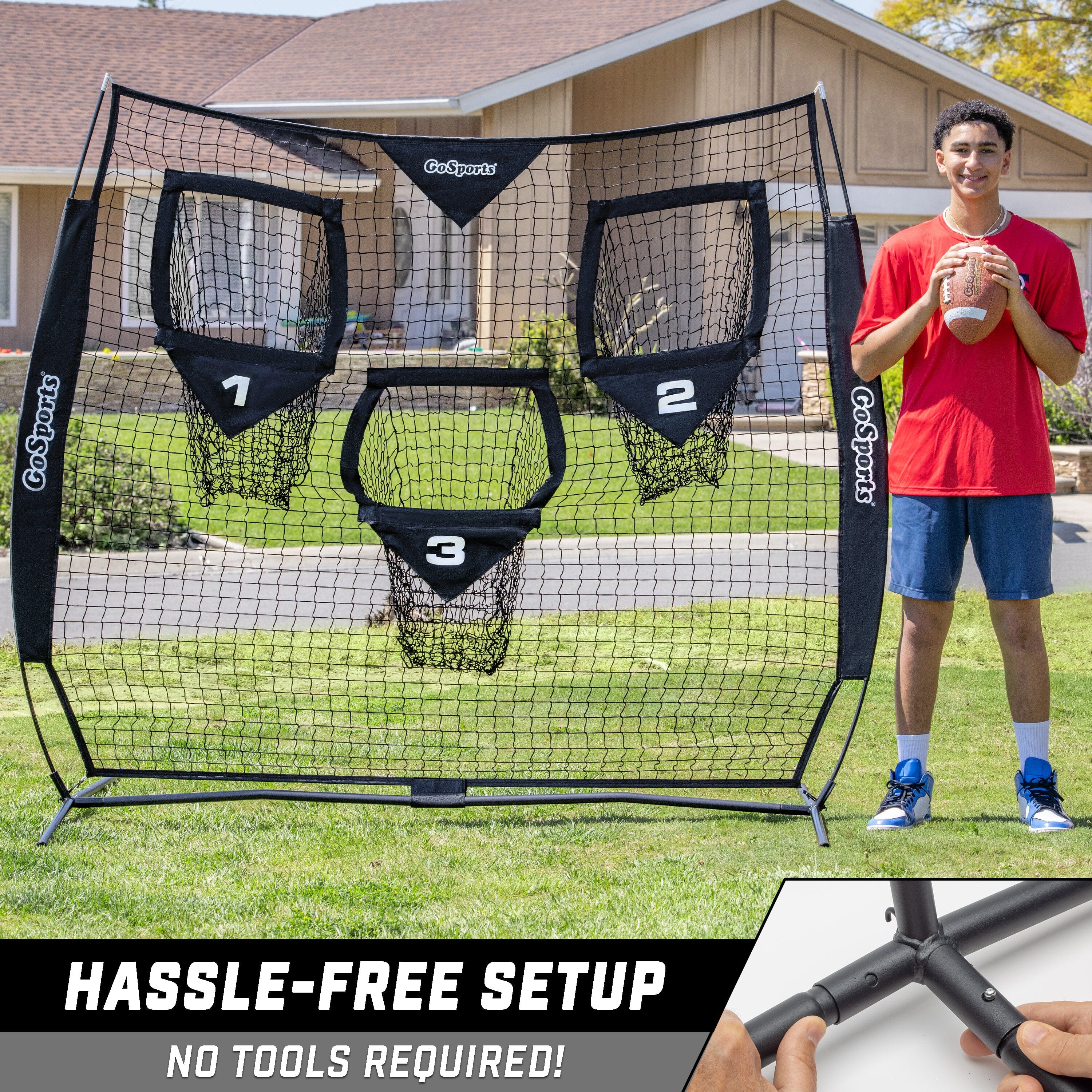 a man holding a baseball bat in front of a net