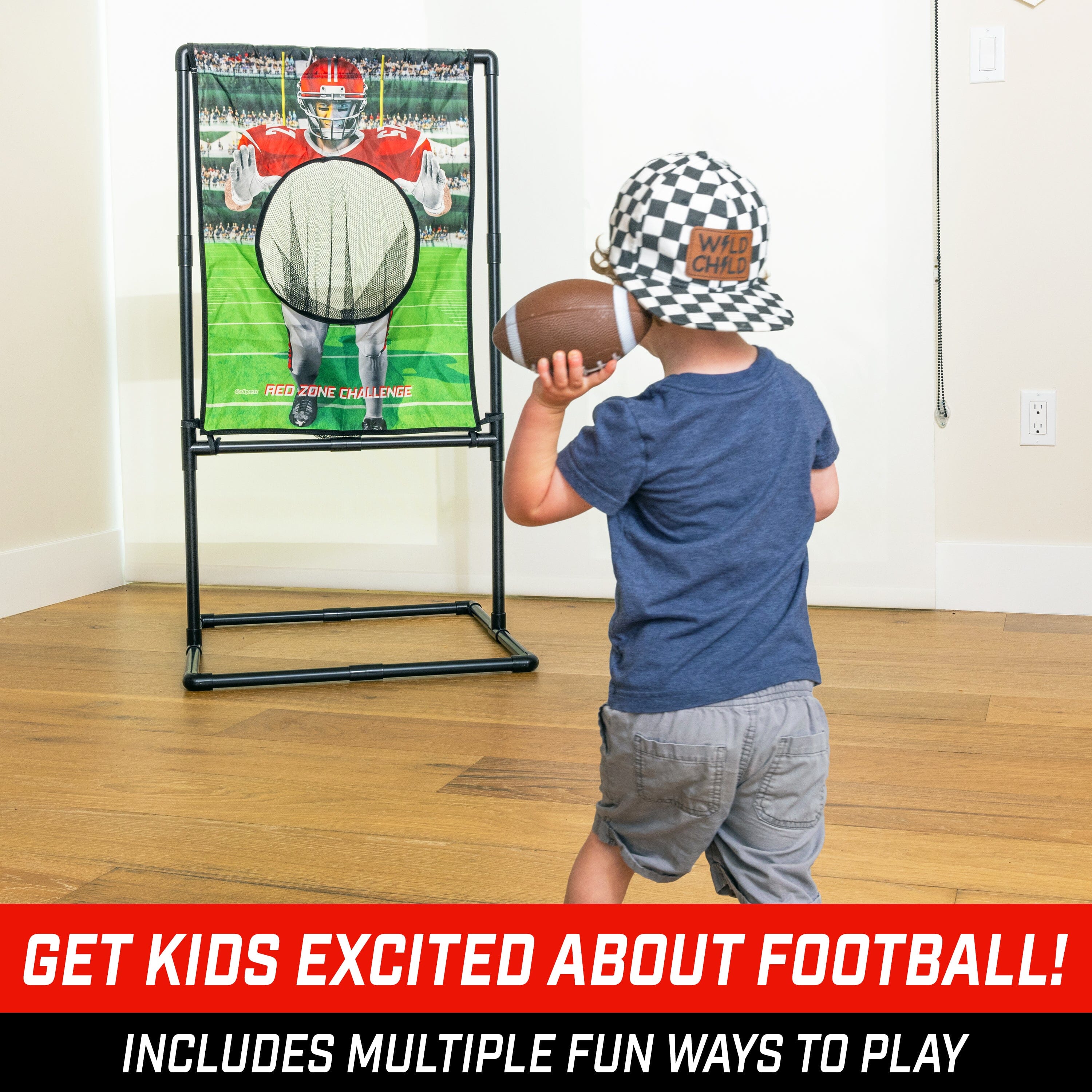 a young boy playing with a football game