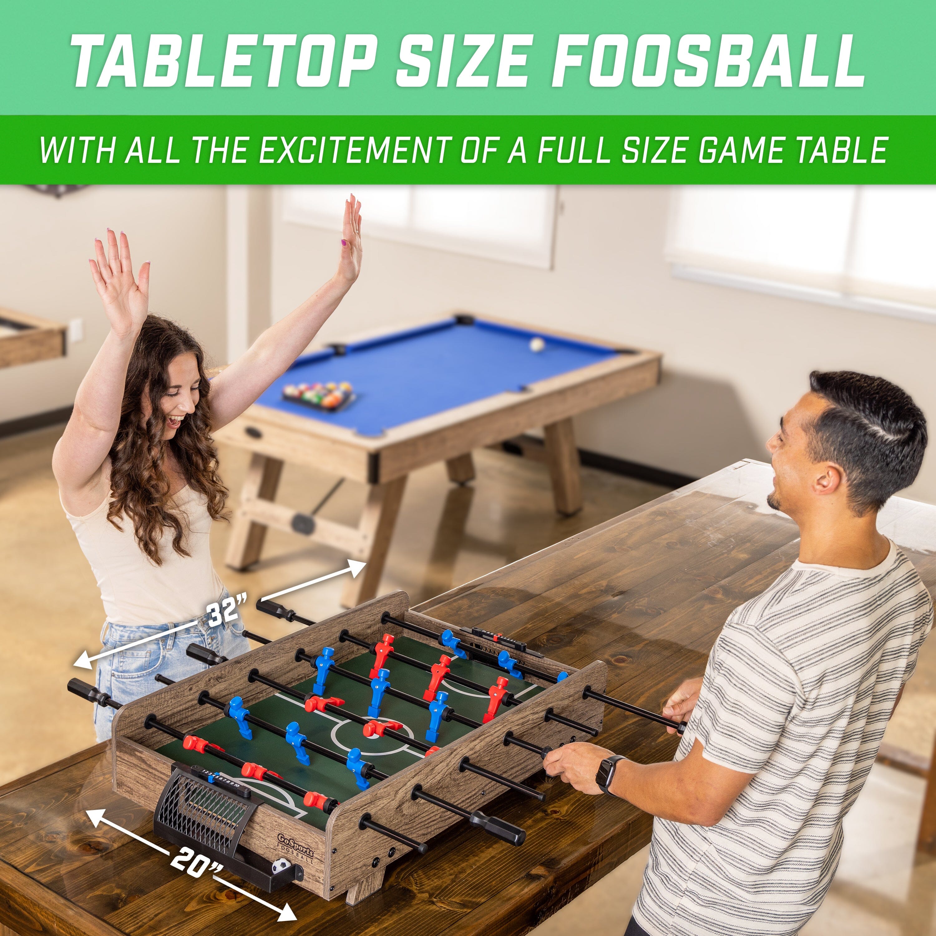 a man and woman playing a game of table football